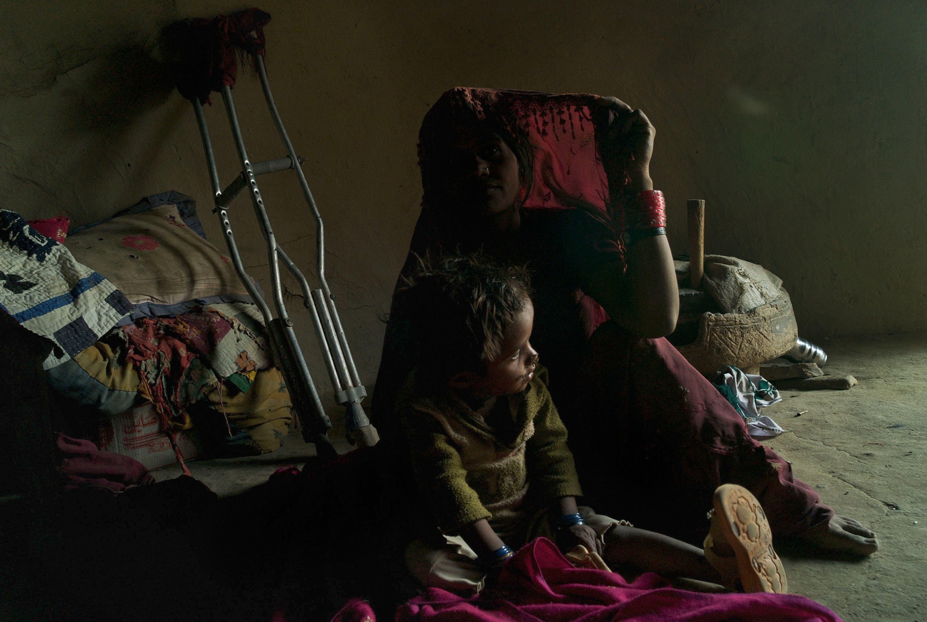 a woman afflicted with polio with her child