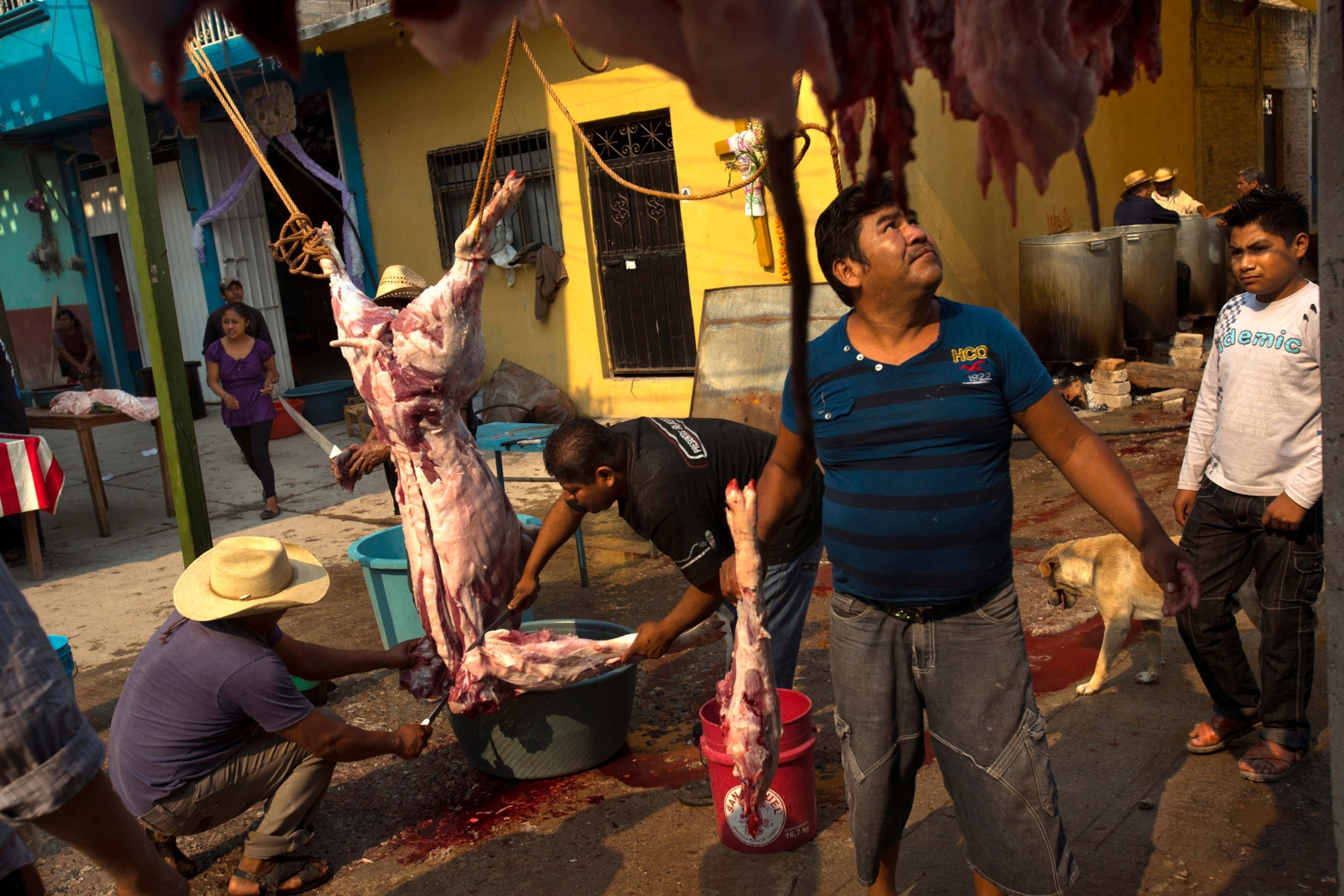 people butchering meat
