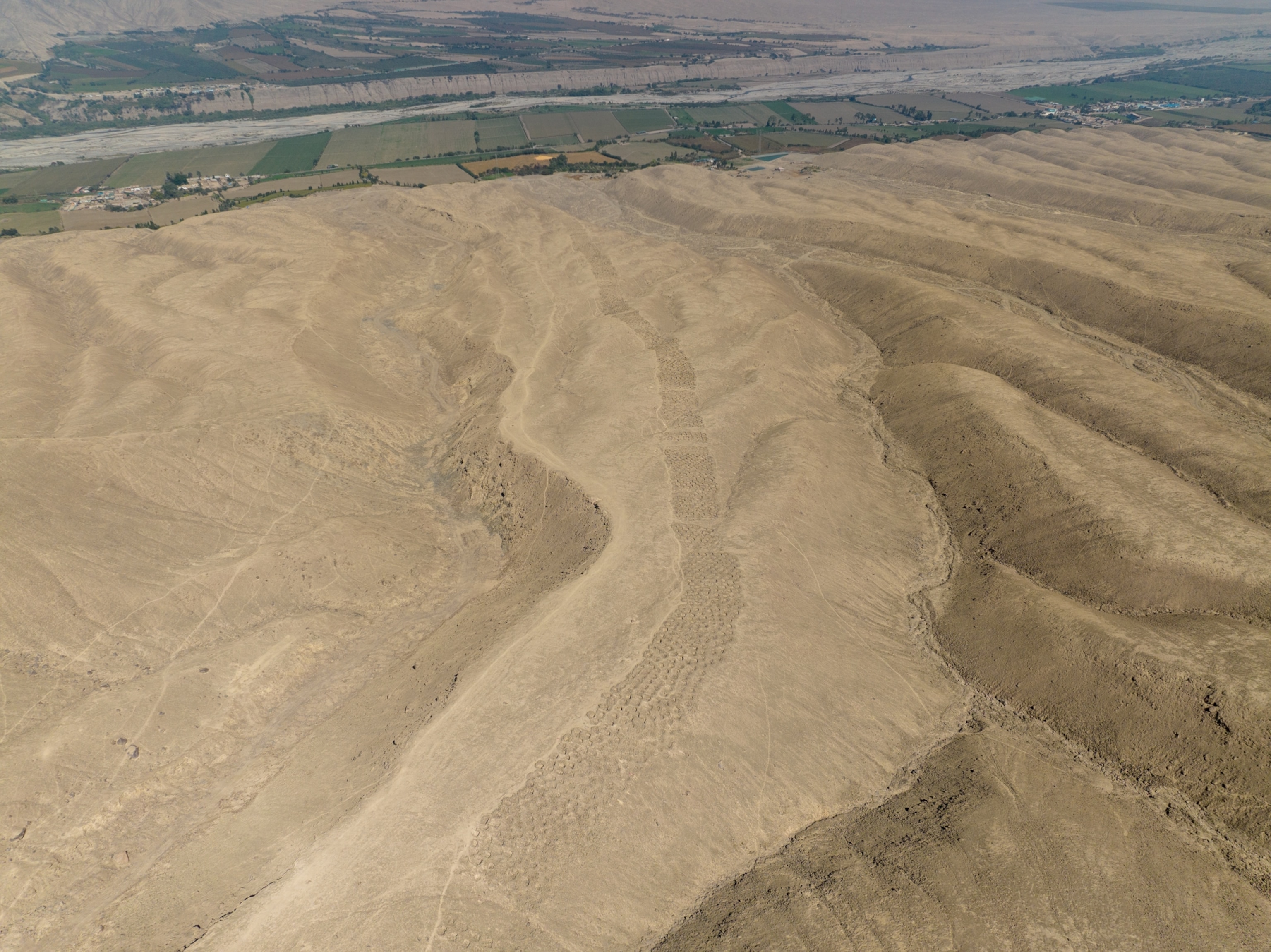 Why did the Inca dig thousands of holes in this mountain? We may now know.  | National Geographic