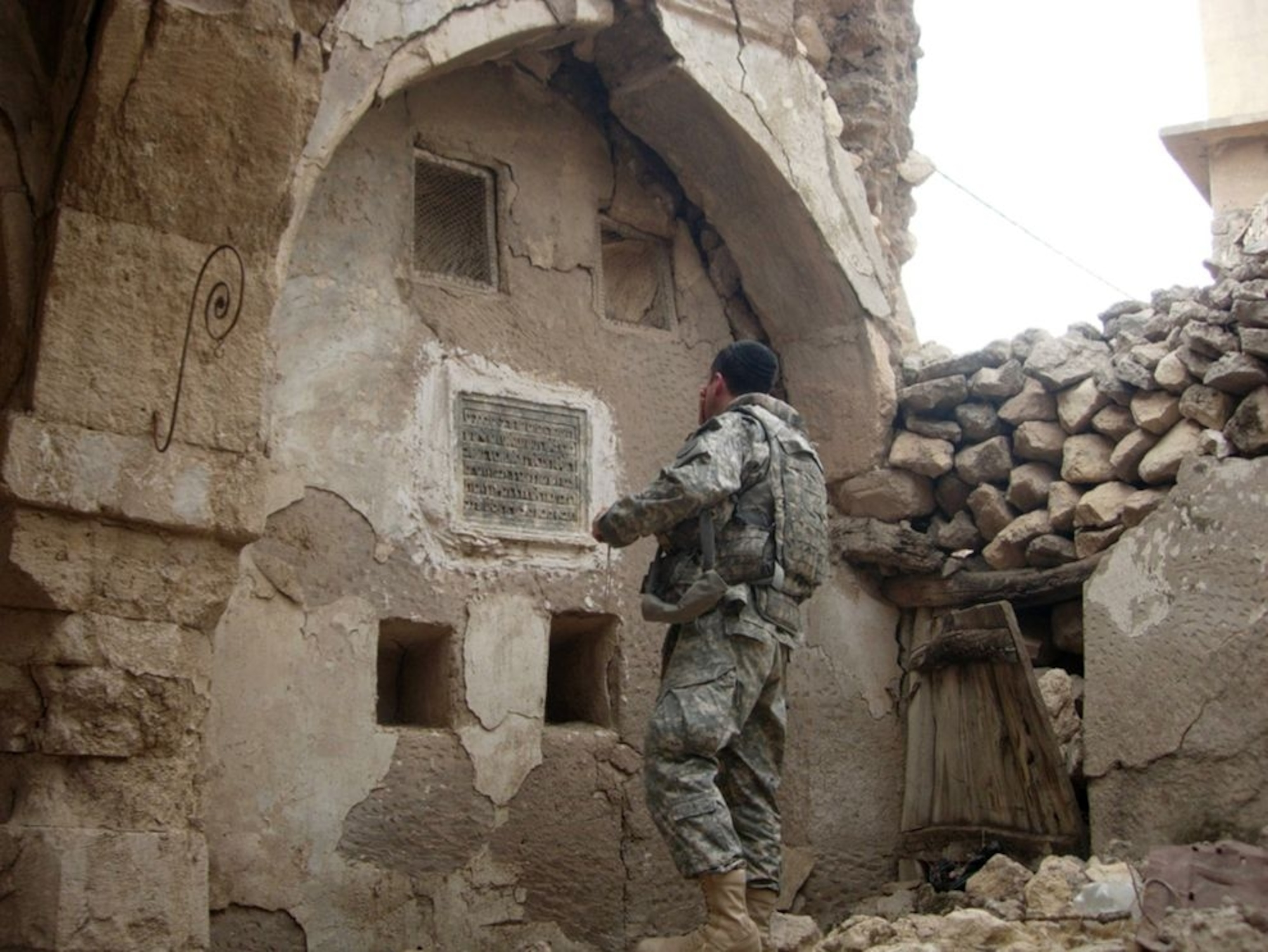 a U.S. Army soldier at an ancient synagogue in Iraq
