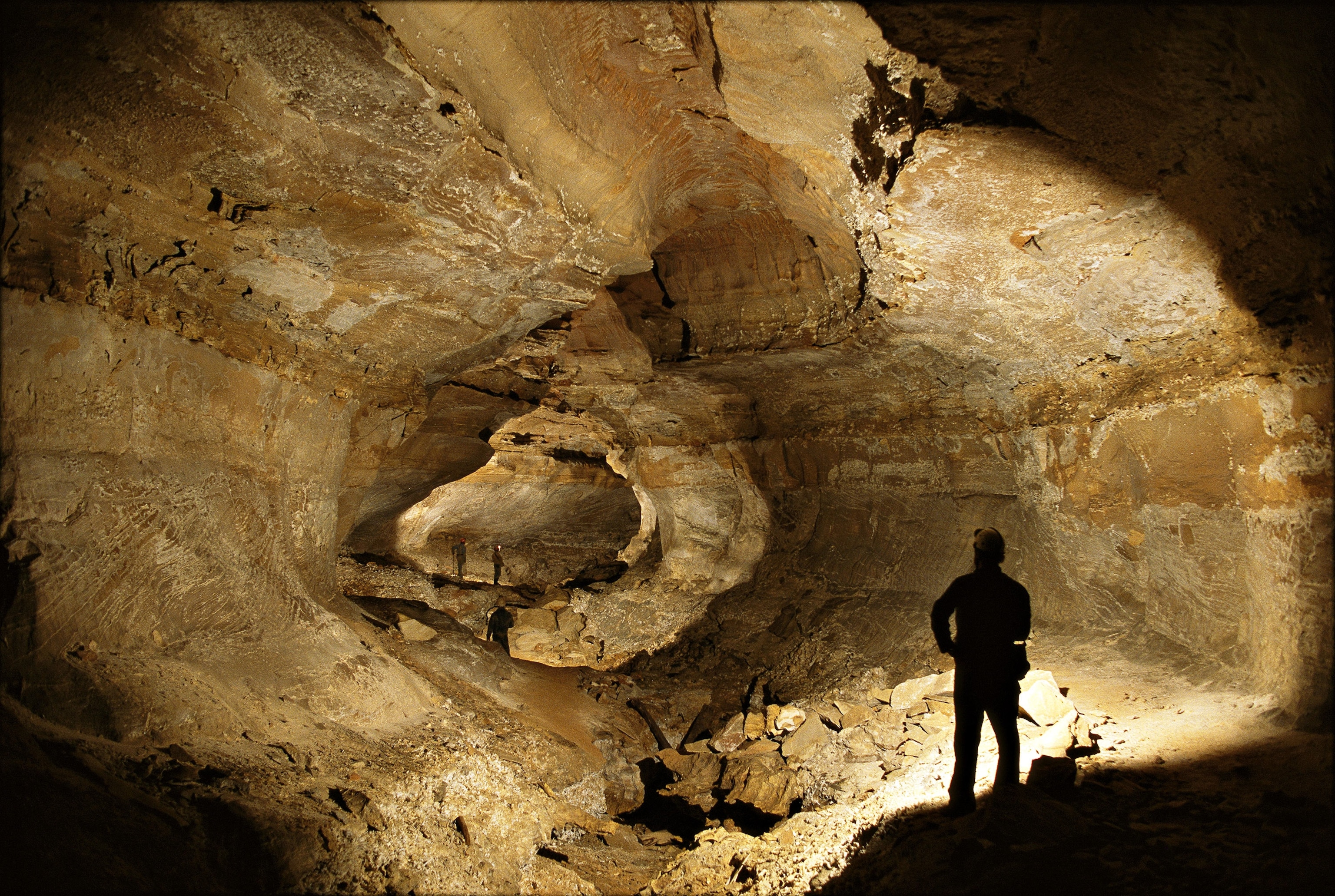 cavers standing in the New Discovery Bore Hole of Mammoth Cave, Kentucky