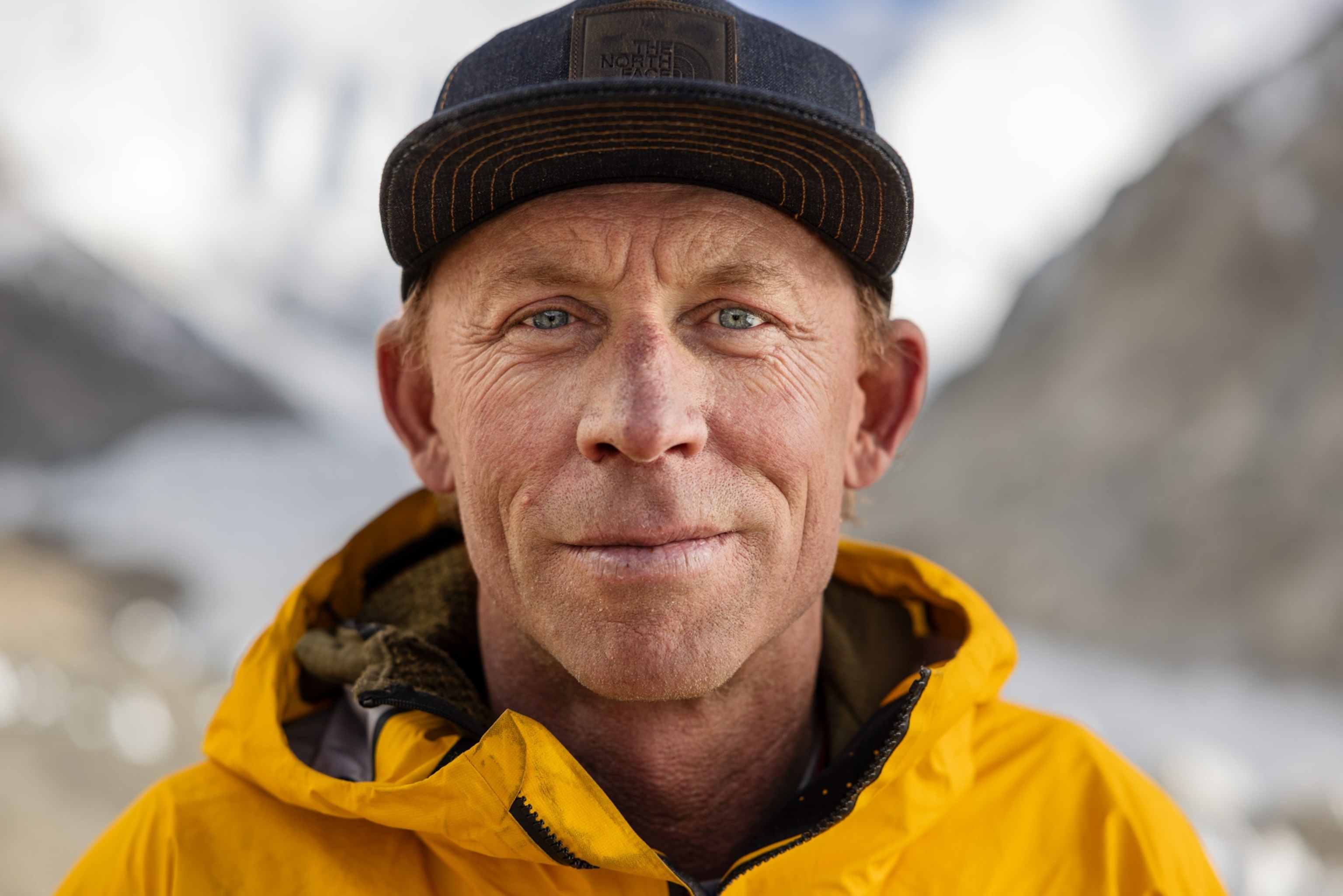 head and shoulder of man wearing a ballcap