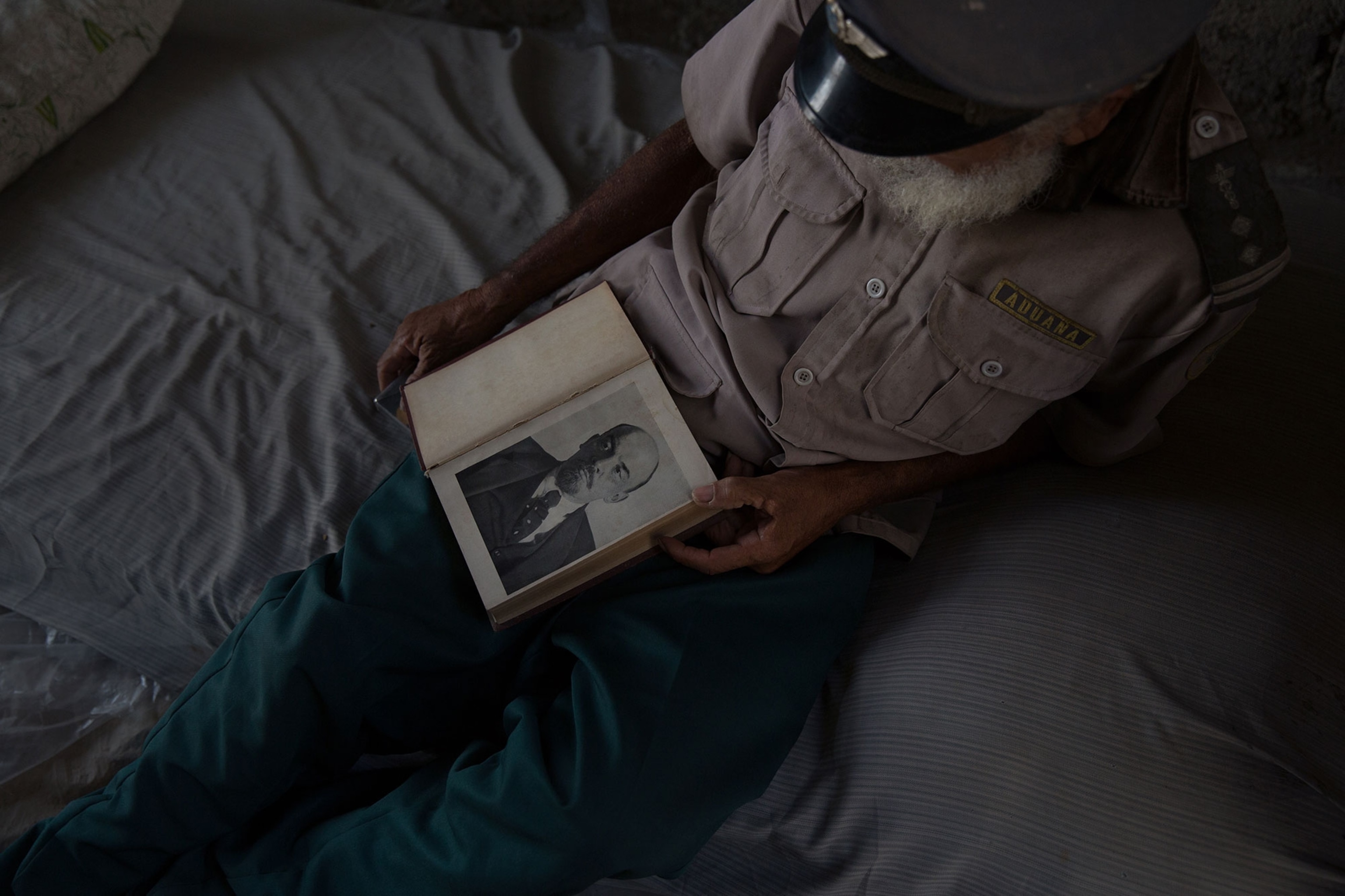 A man holds a book about the life of Vladimir Lenin