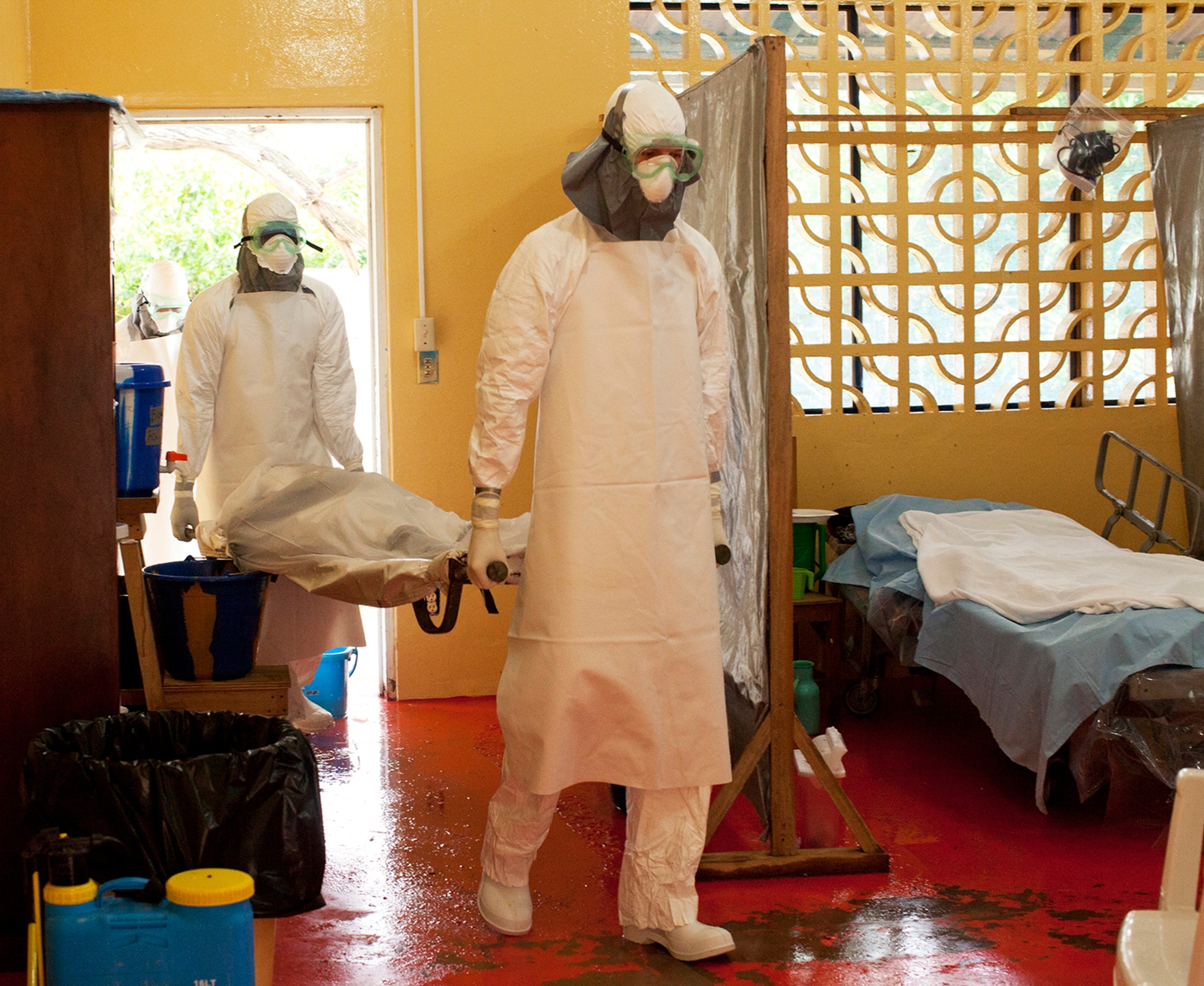 A handout photo provided by Samaritan's Purse on 01 August 2014 shows Dr. Kent Brantly (R) working at an Ebola treatment clinic in Foya, Liberia, 23 June 2014.