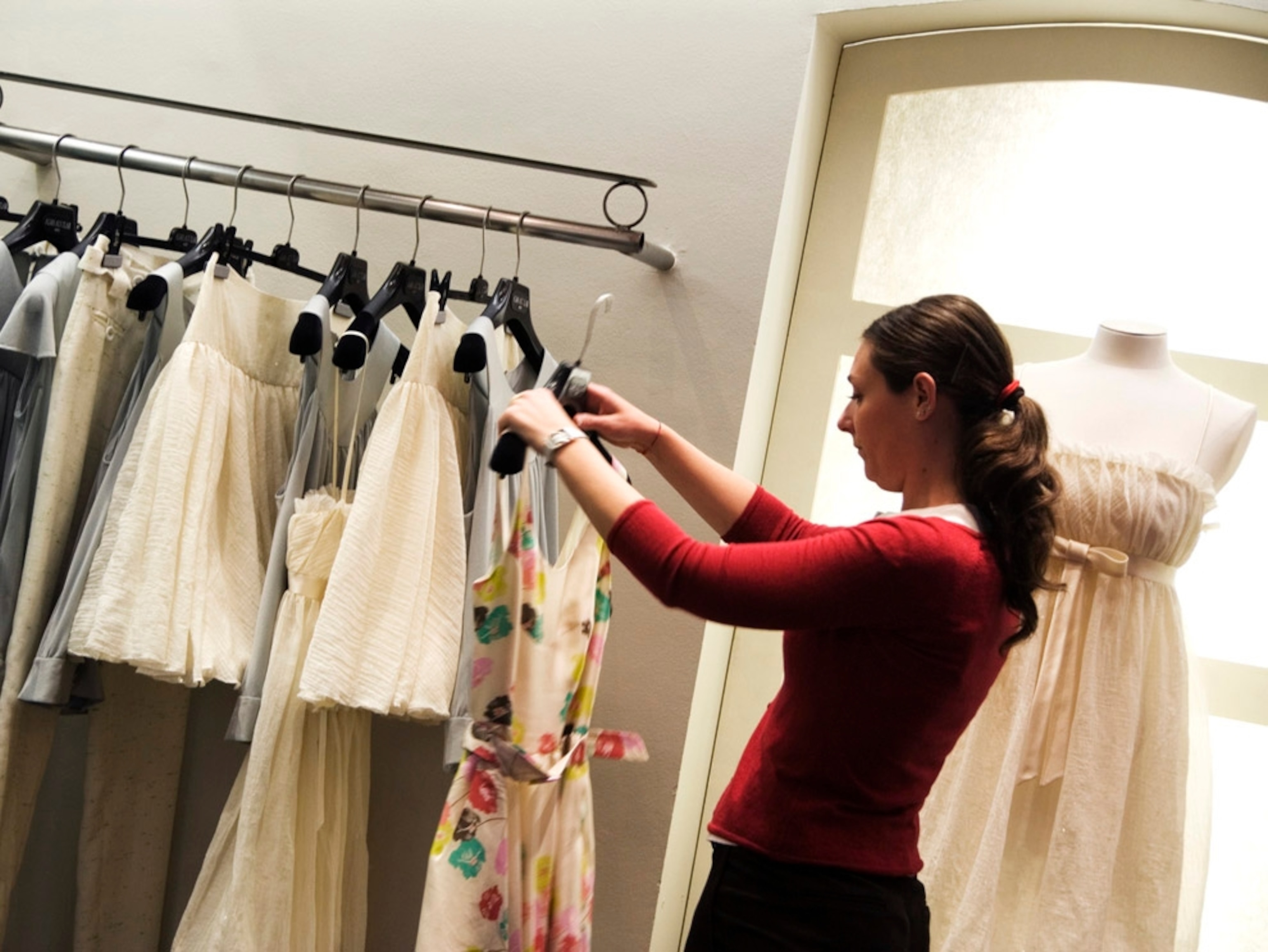 Woman looking at clothes on a rack