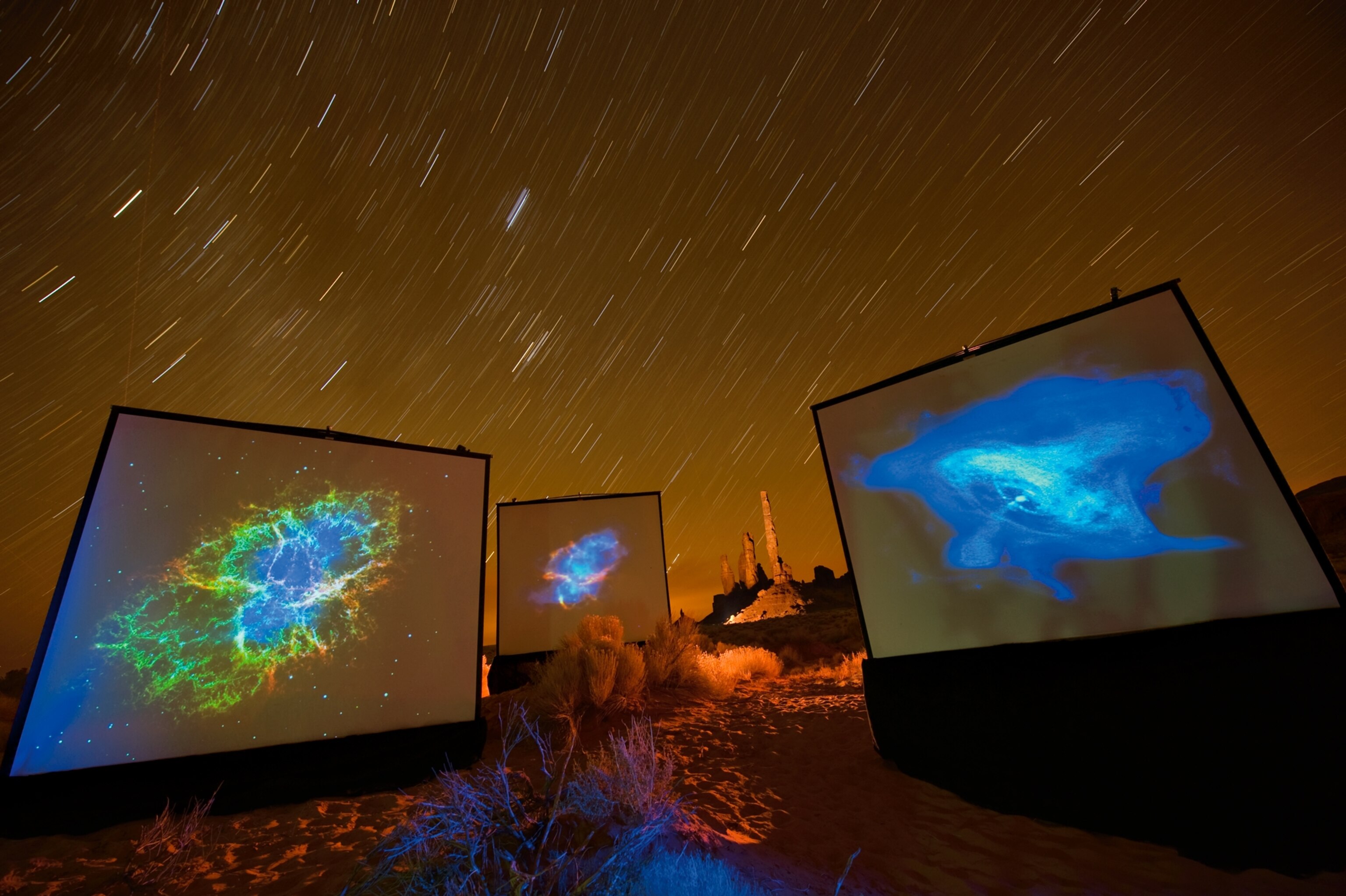 the Crab Nebula are projected on screens in Monument Valley, Utah