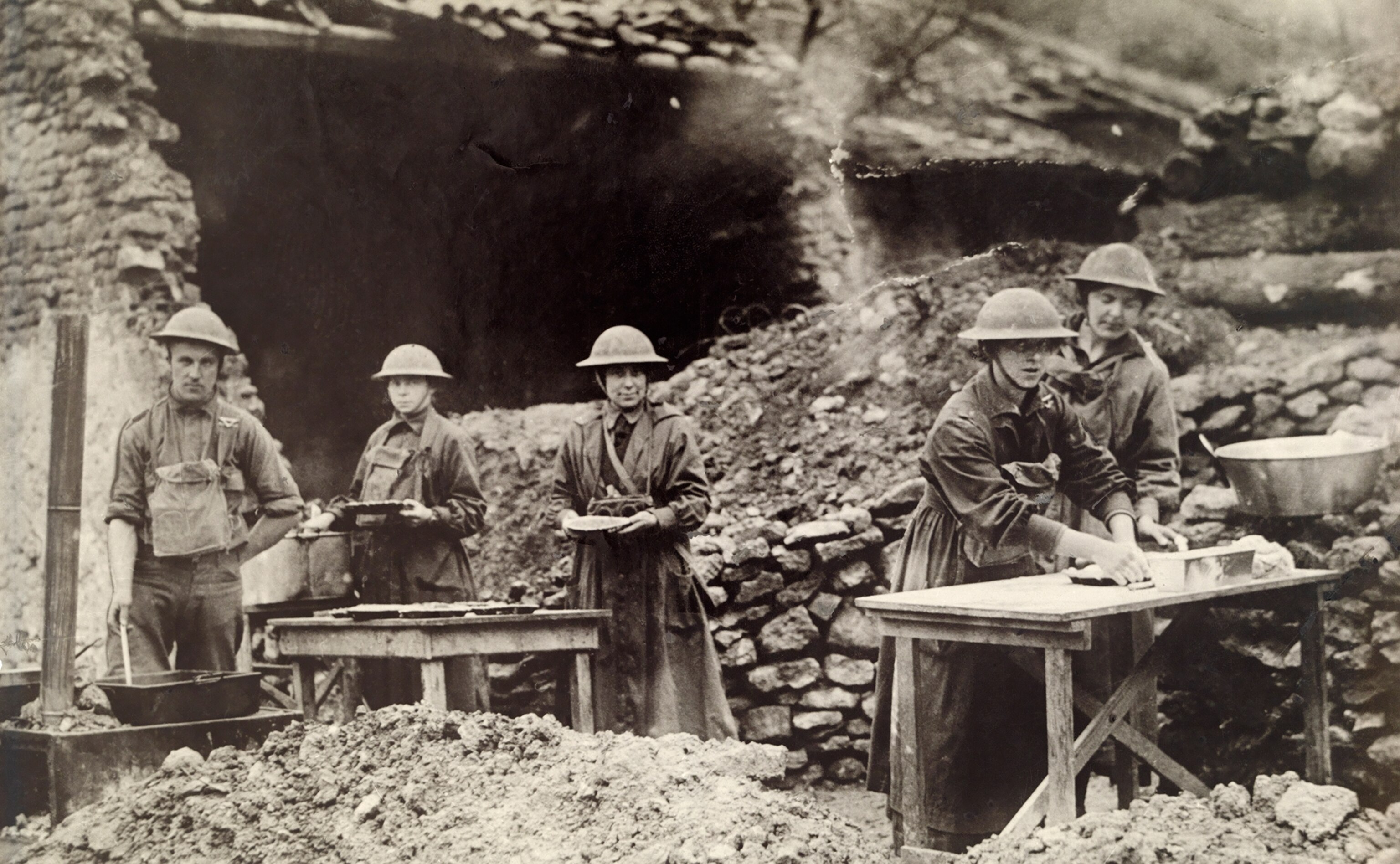 women in helmets making pies