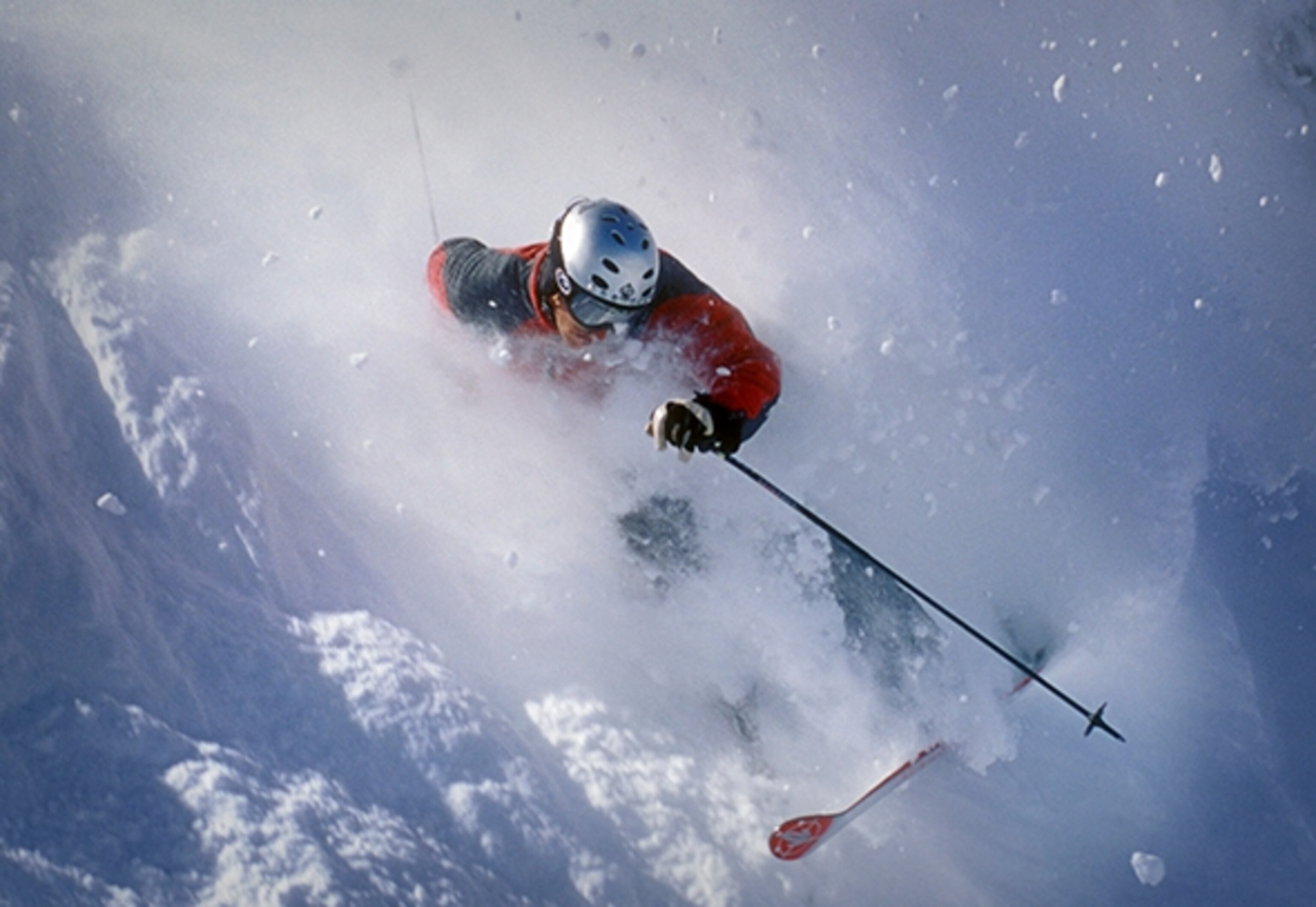 Skier carves a aggressive turn in Telluride, Colorado.