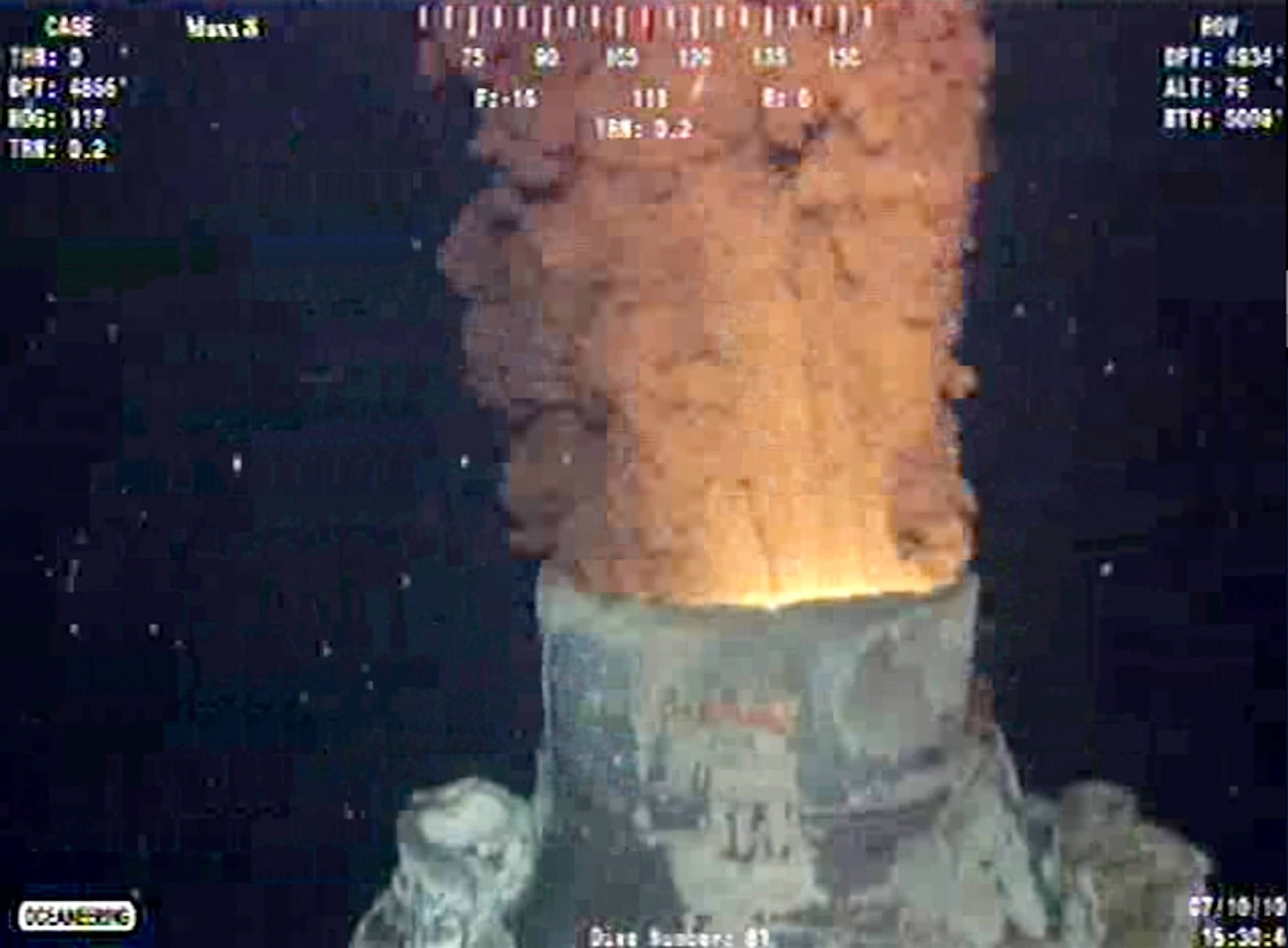 oil gushing from BP's Macondo well after old top hat oil-containment cap is removed.