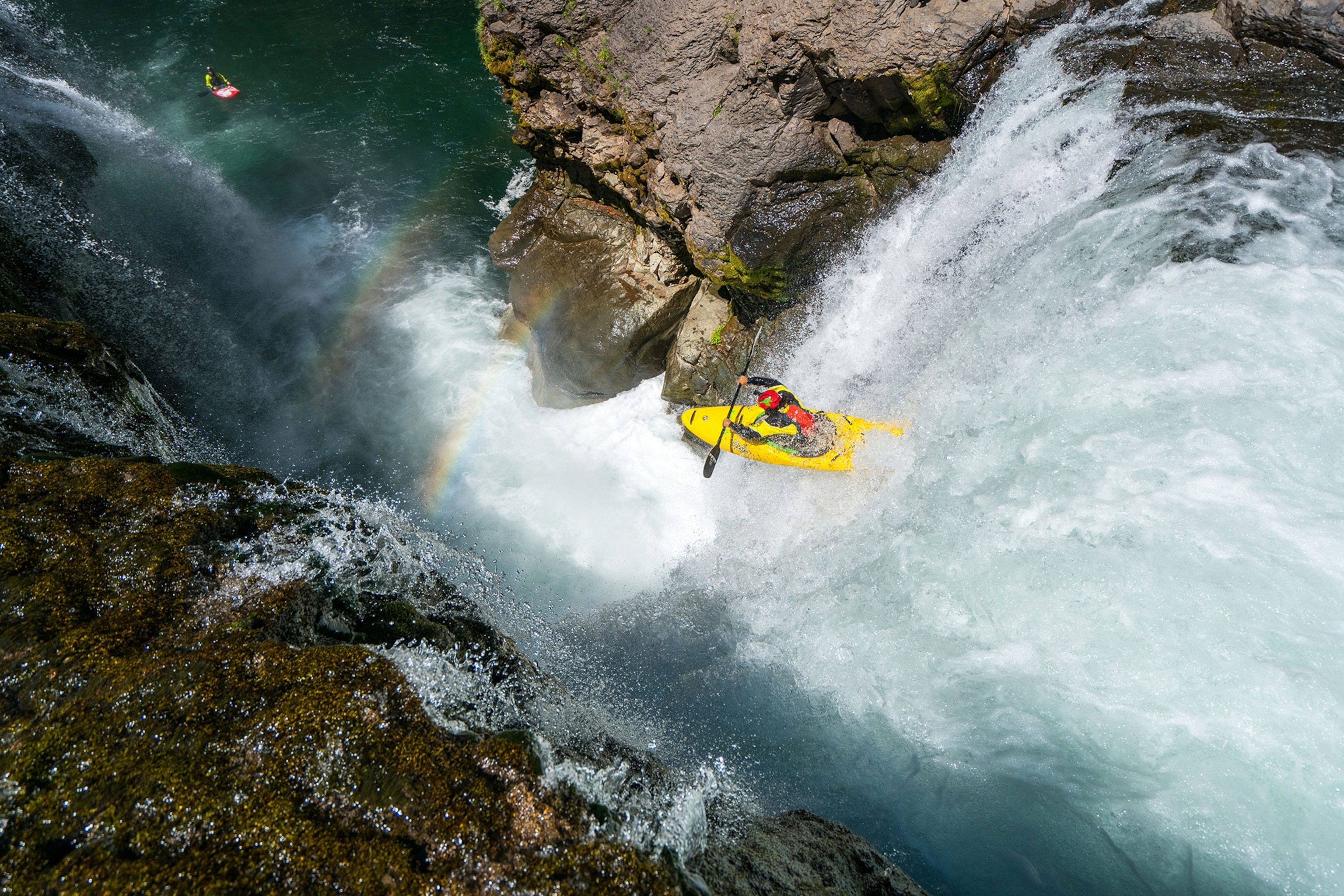 a kayaker launching off a waterfall in Washington state