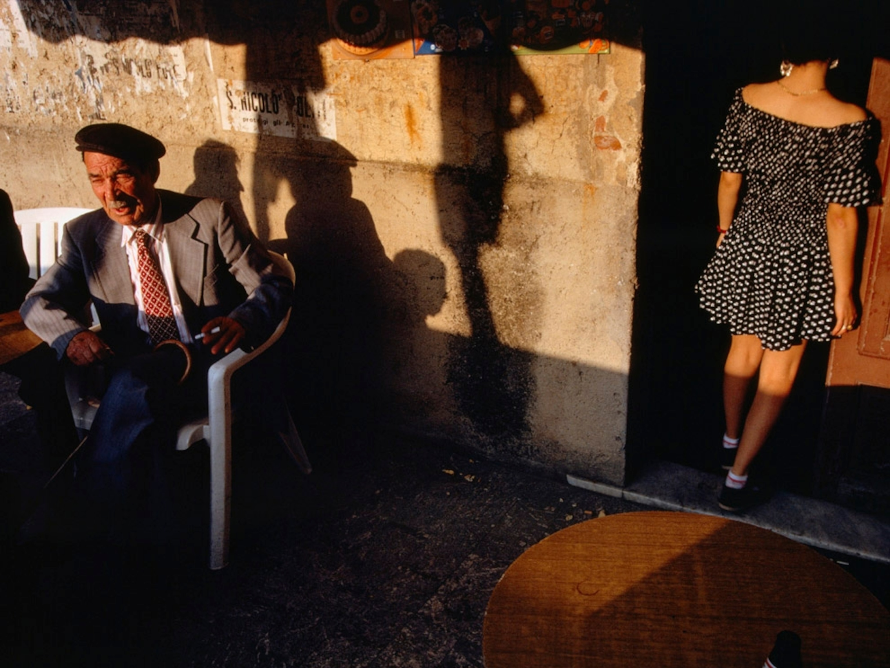 Man sitting outside of a cafe