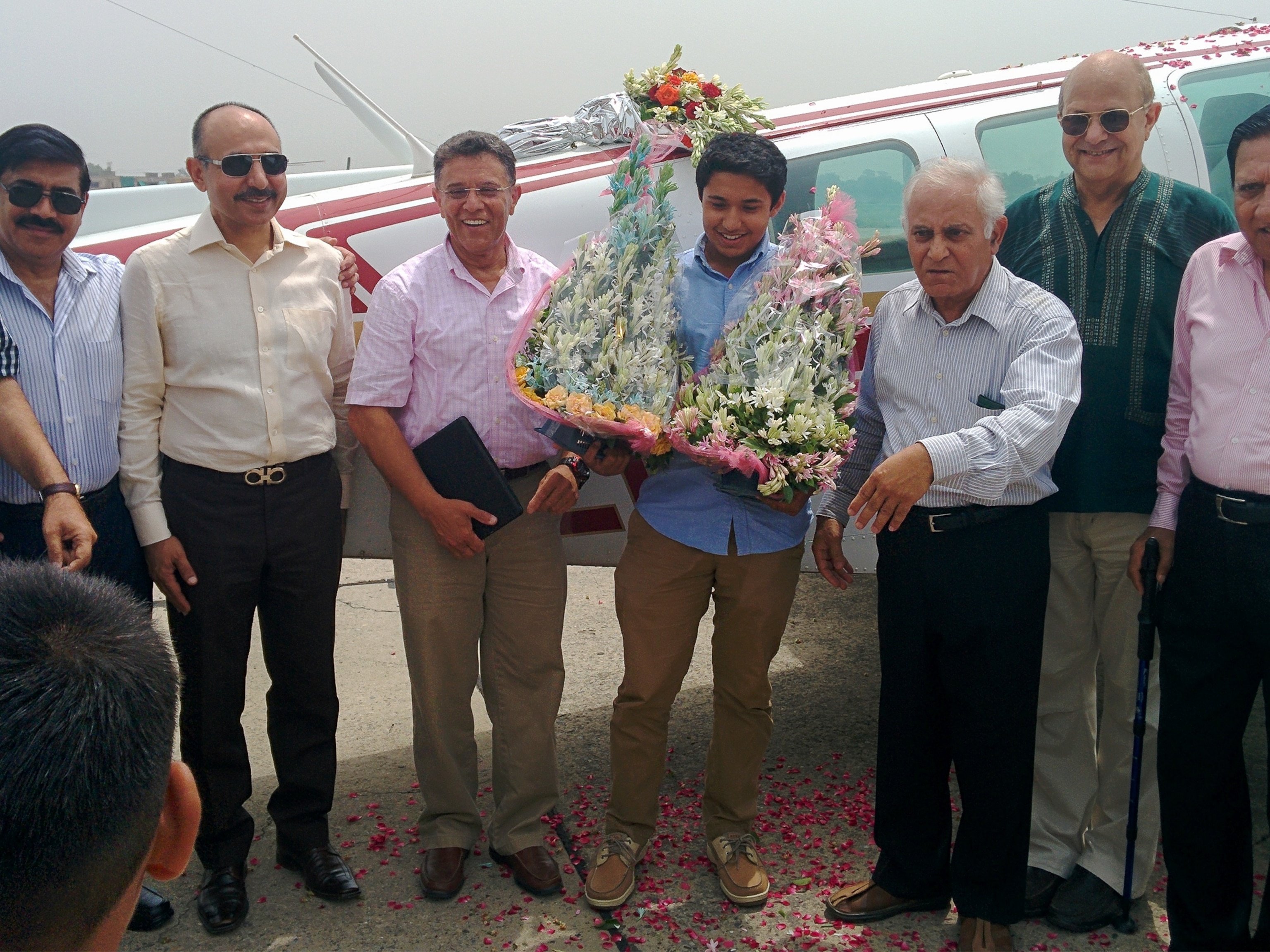 Babar and Haris Suleman receiving flowers.