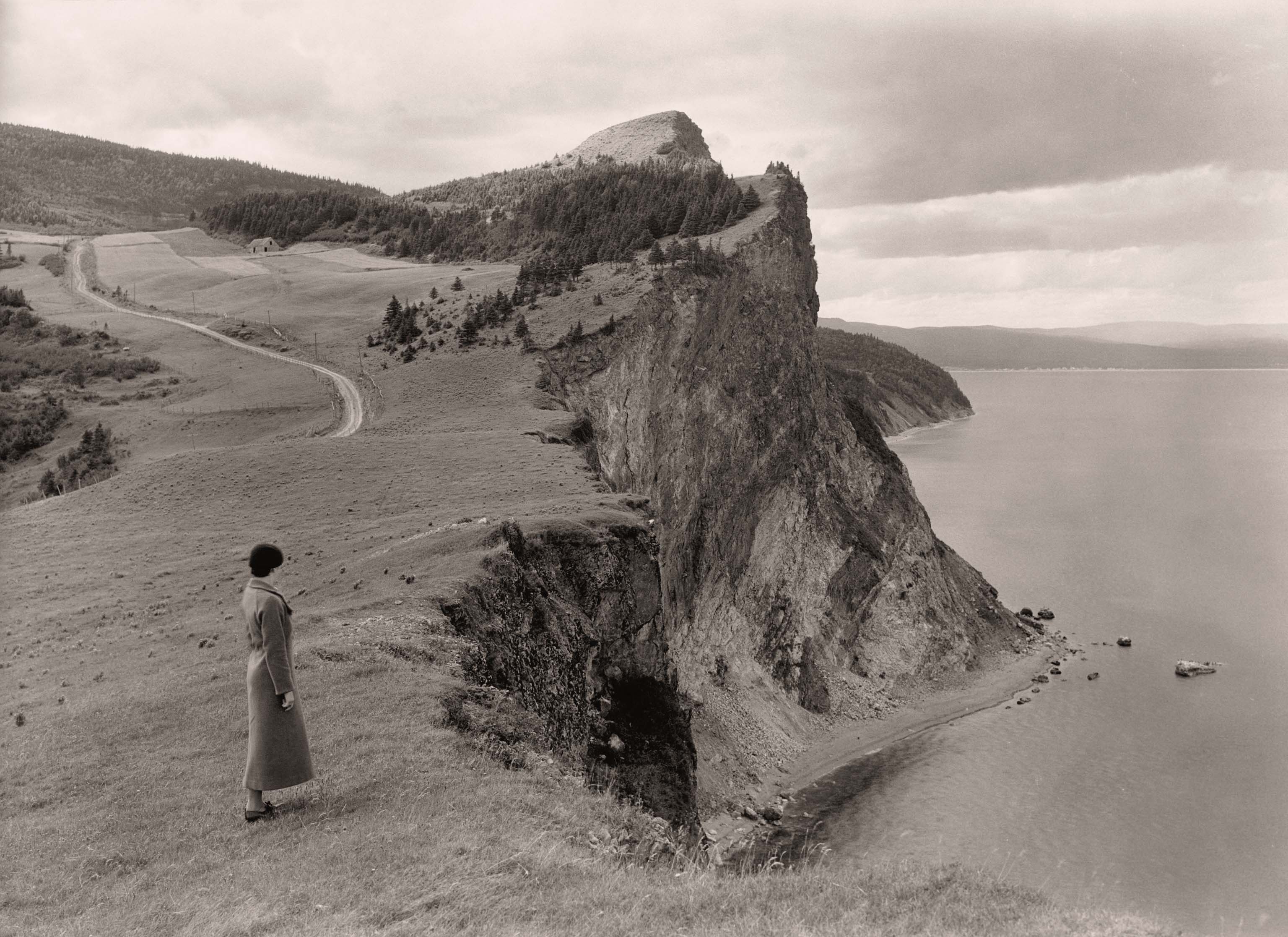 woman standing near cliff