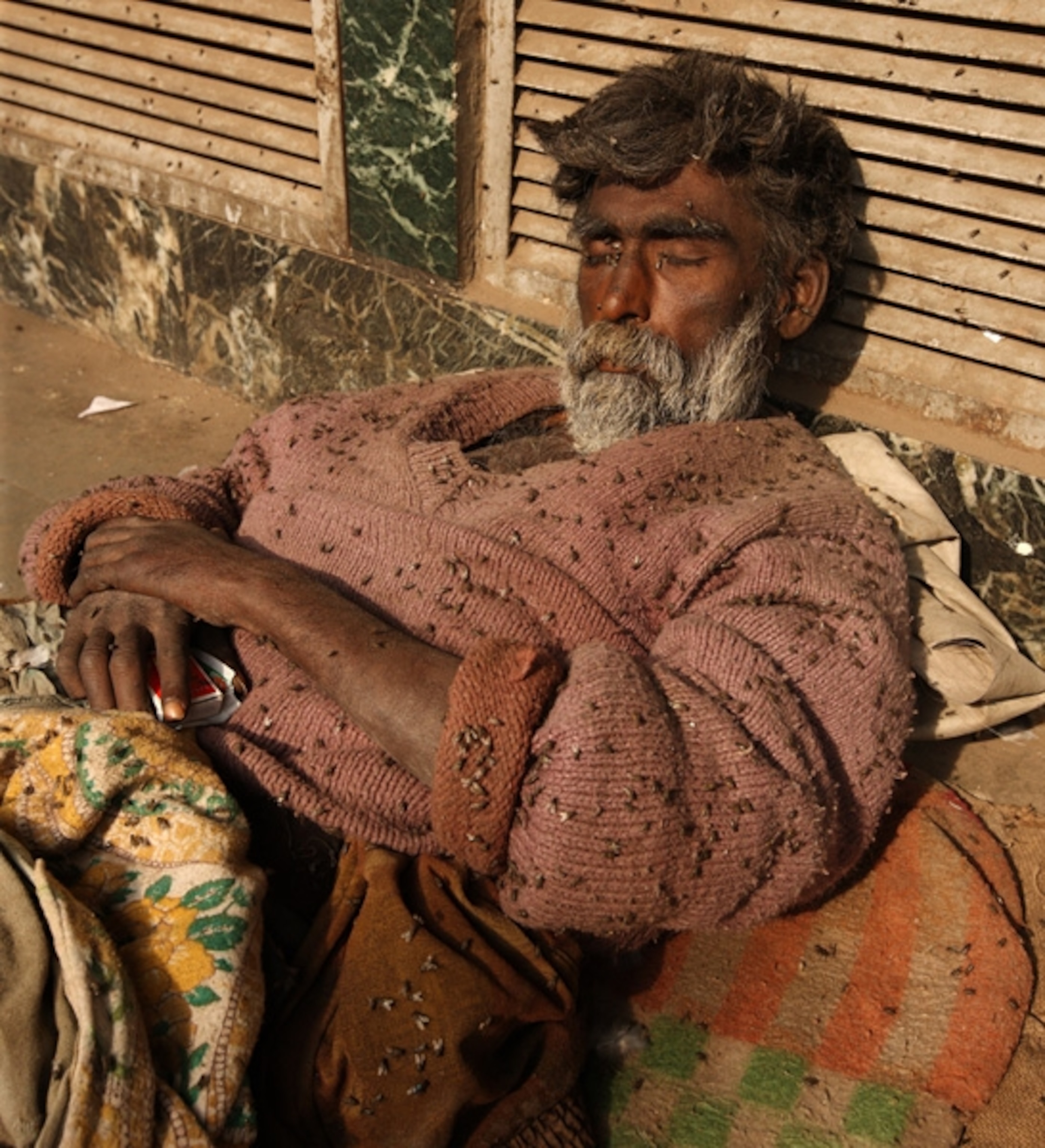 A man asleep on the street