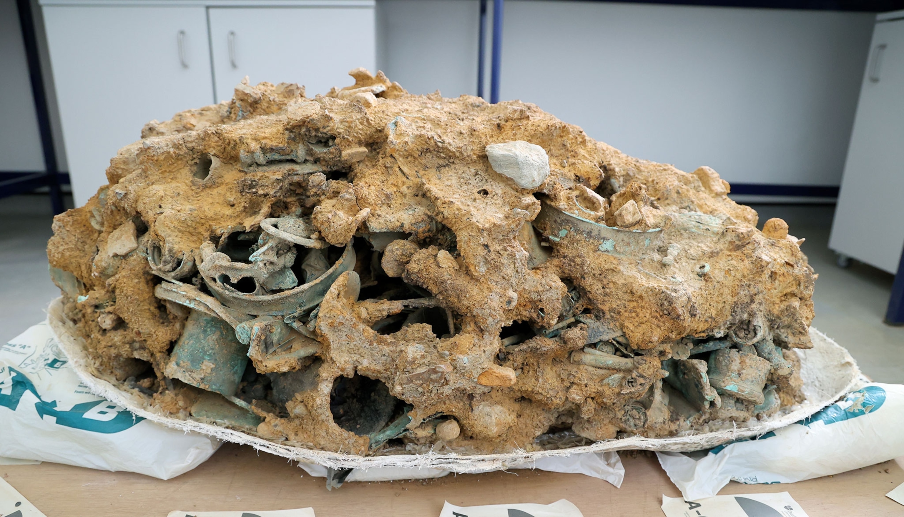 A large chunk of of dirt clumped with bits of objects.