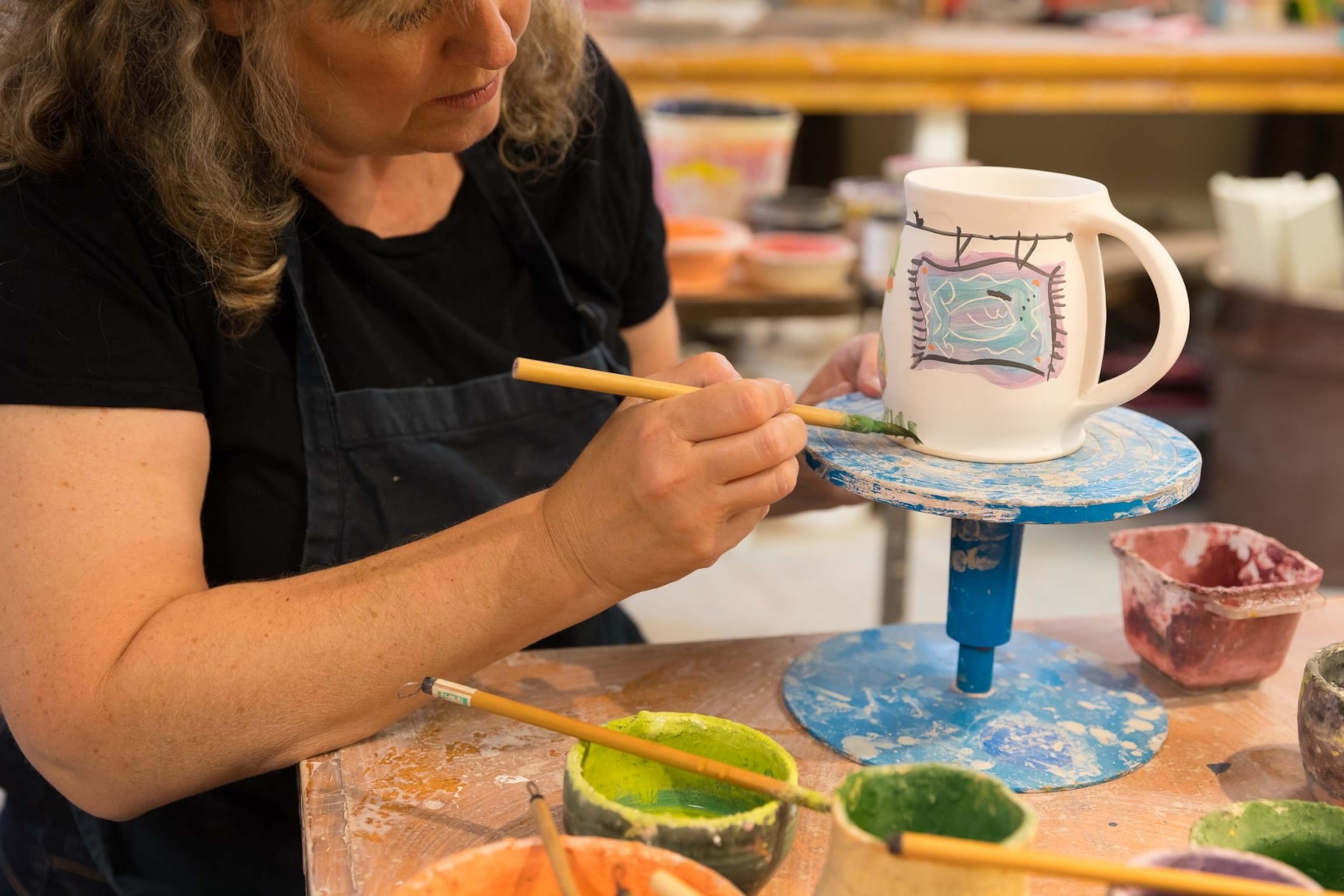 Staci Barron, Elora Pottery, working in her studio. Ontario