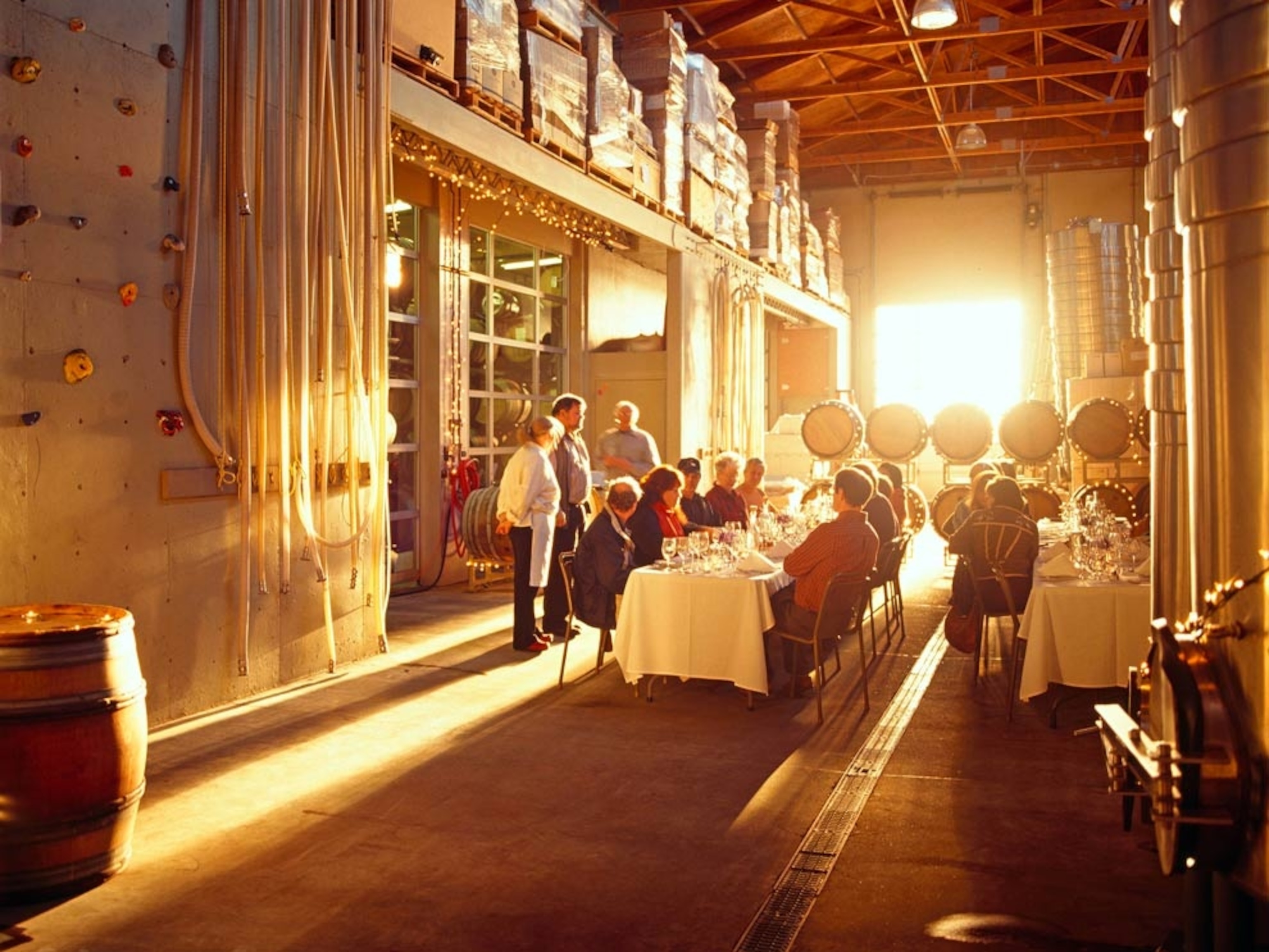 People eating dinner in a winery