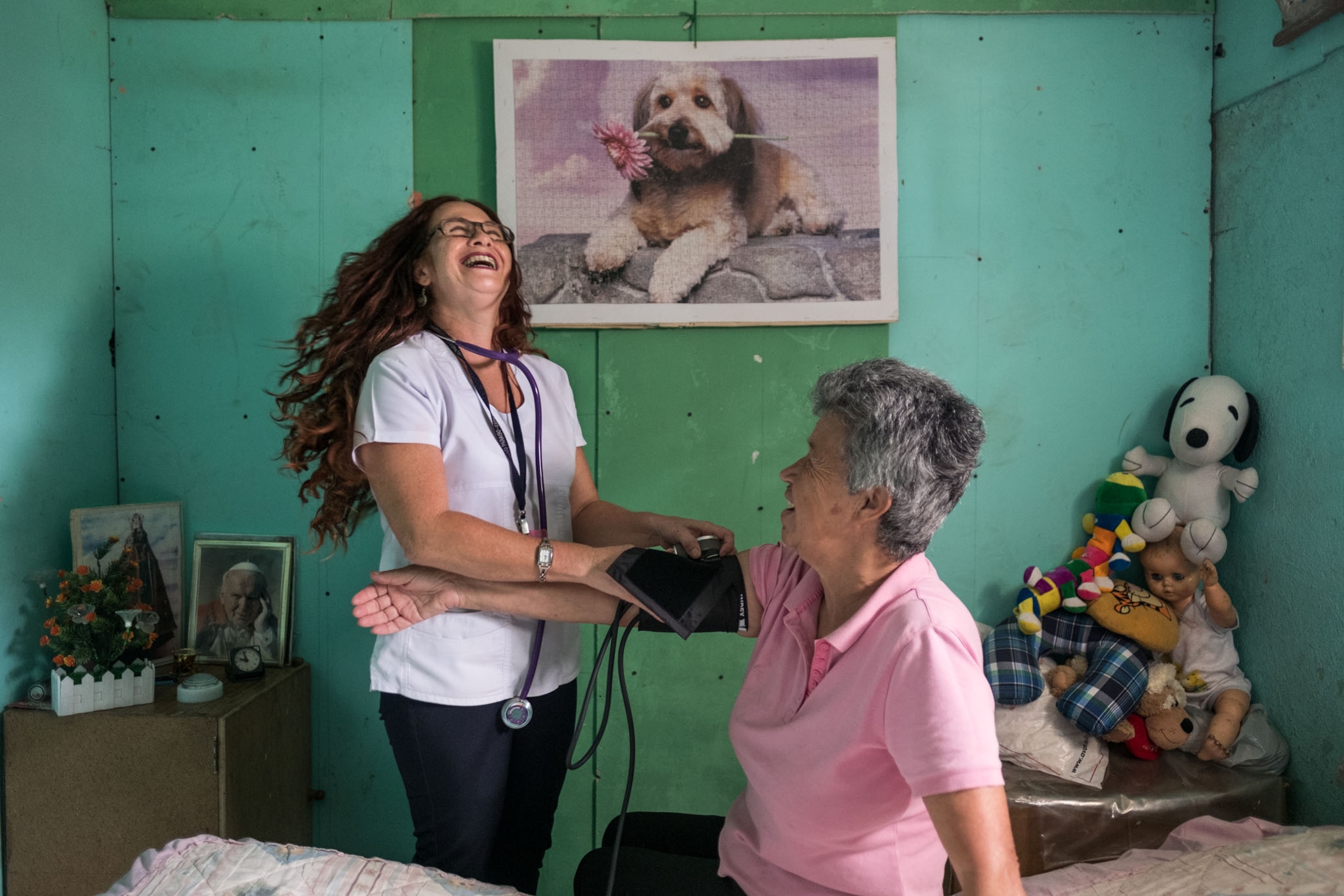medical technician from government health care program checking on living alone a widow.