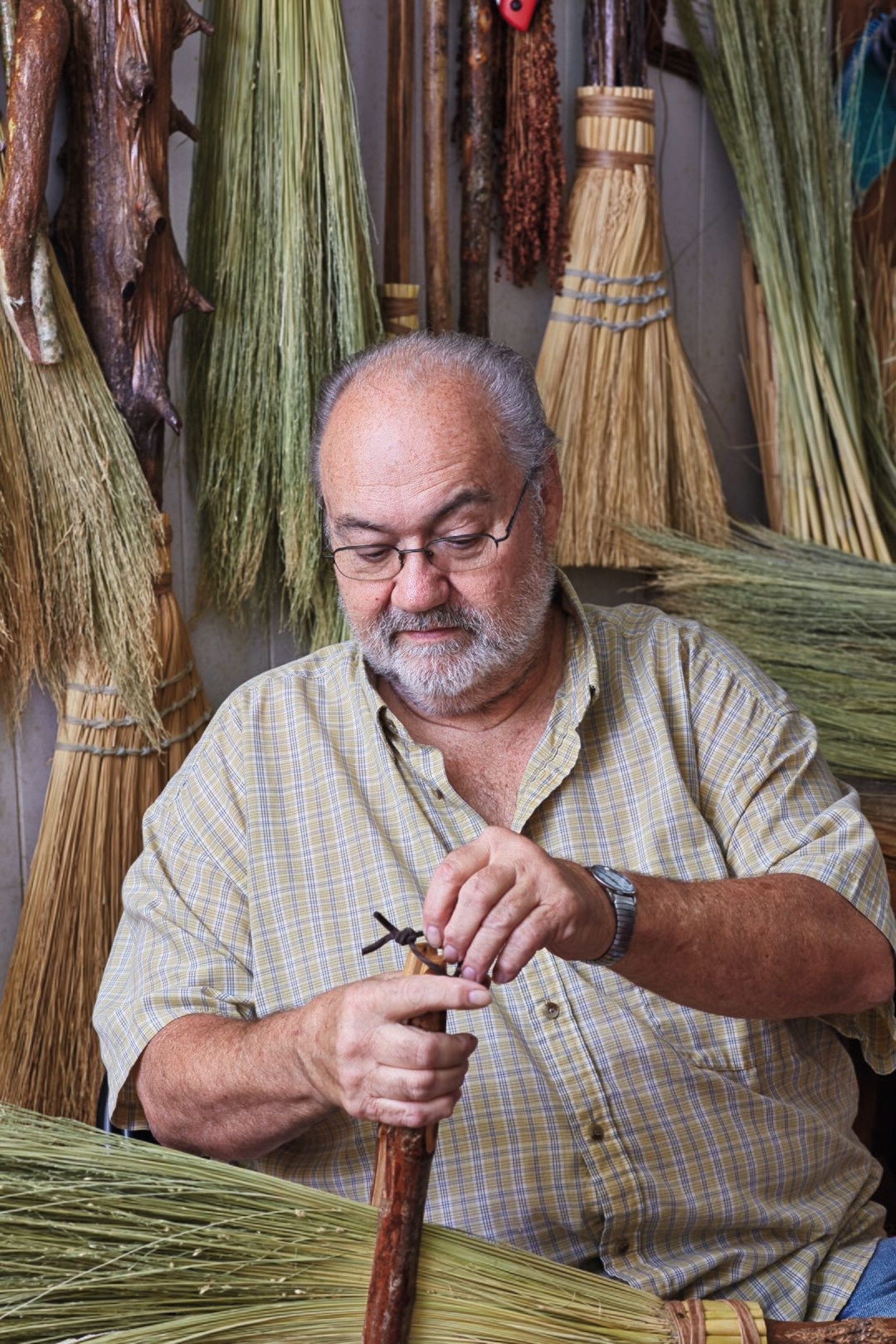 Man at work in Ogle’s Broom Shop, Gatlinburg.