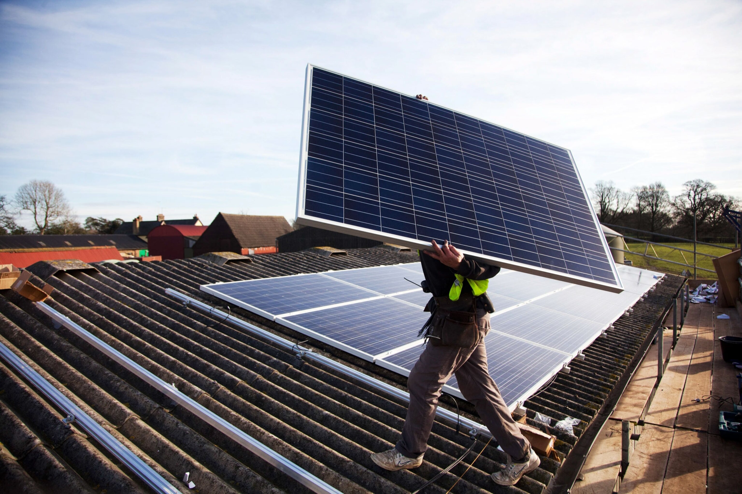 a man installing solar panels