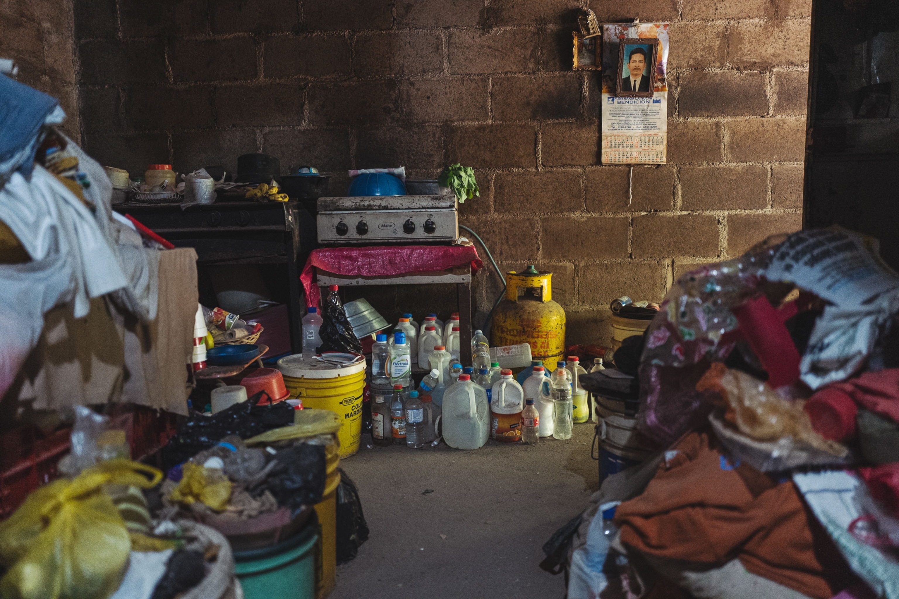 water bottles inside a woman's home in El Salvador