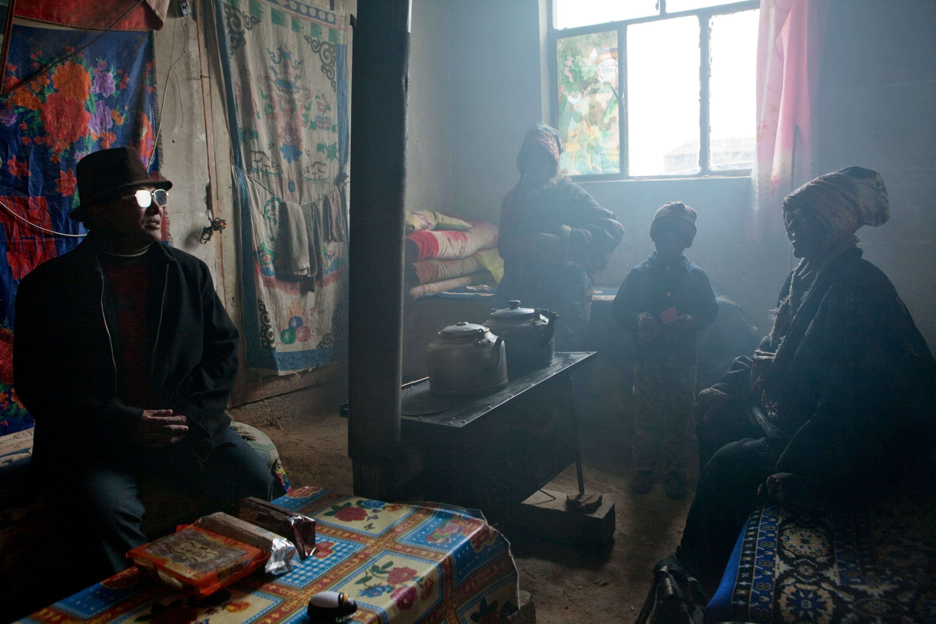 haze hanging over nomads at home in a resettlement village in China's Qinghai Province