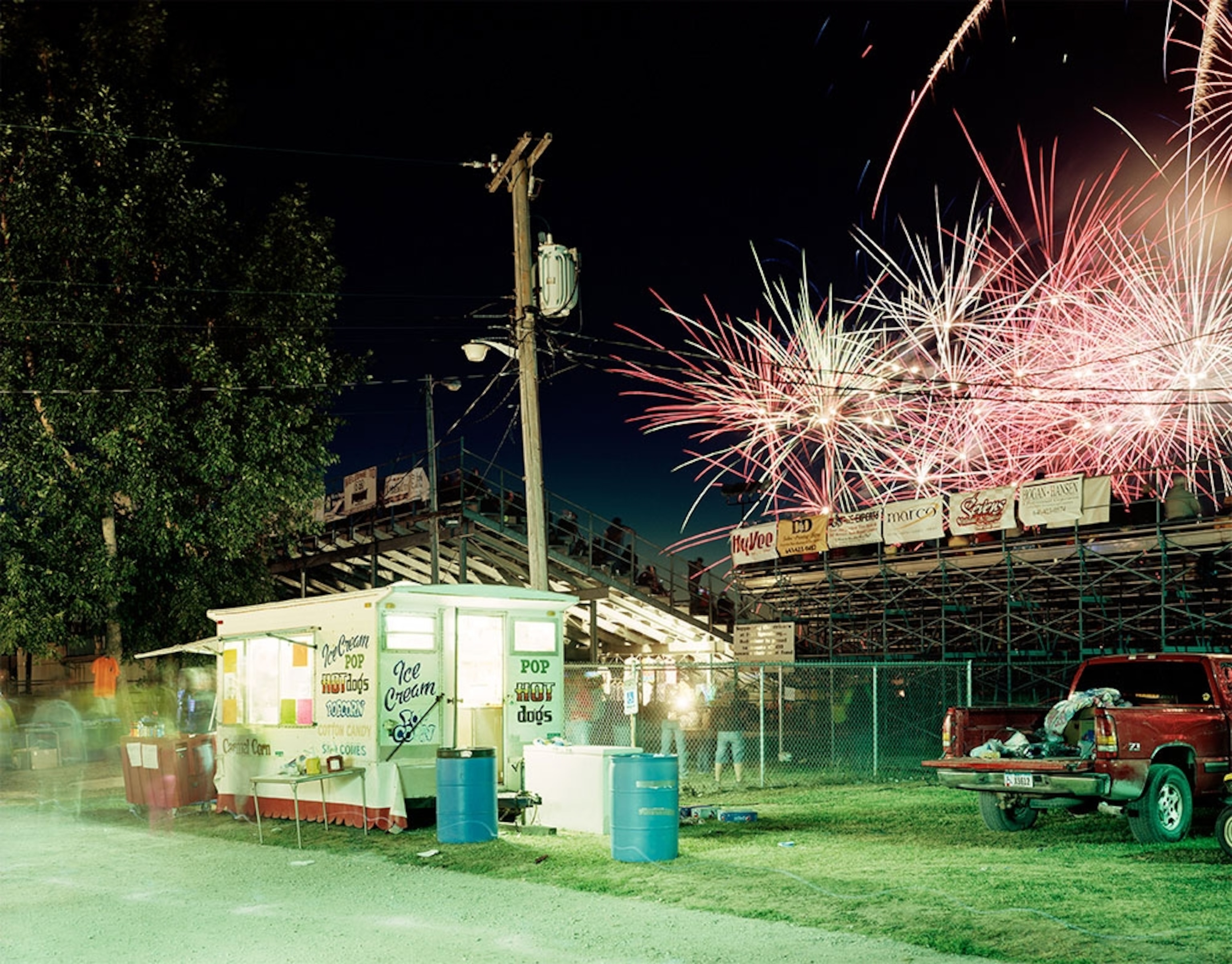 Food vendor with grandstands and evening displays.