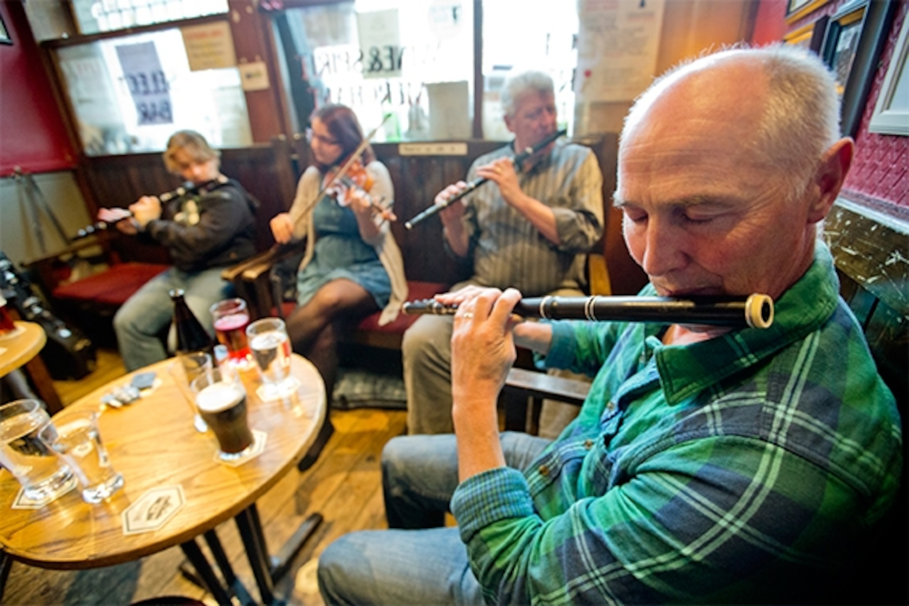 Musicians gather every evening of the week at The Cobblestone, well-known for traditional Irish music. Ultra-casual, musicians arrive, join in and leave as they wish. (Photograph by Catherine Karnow)