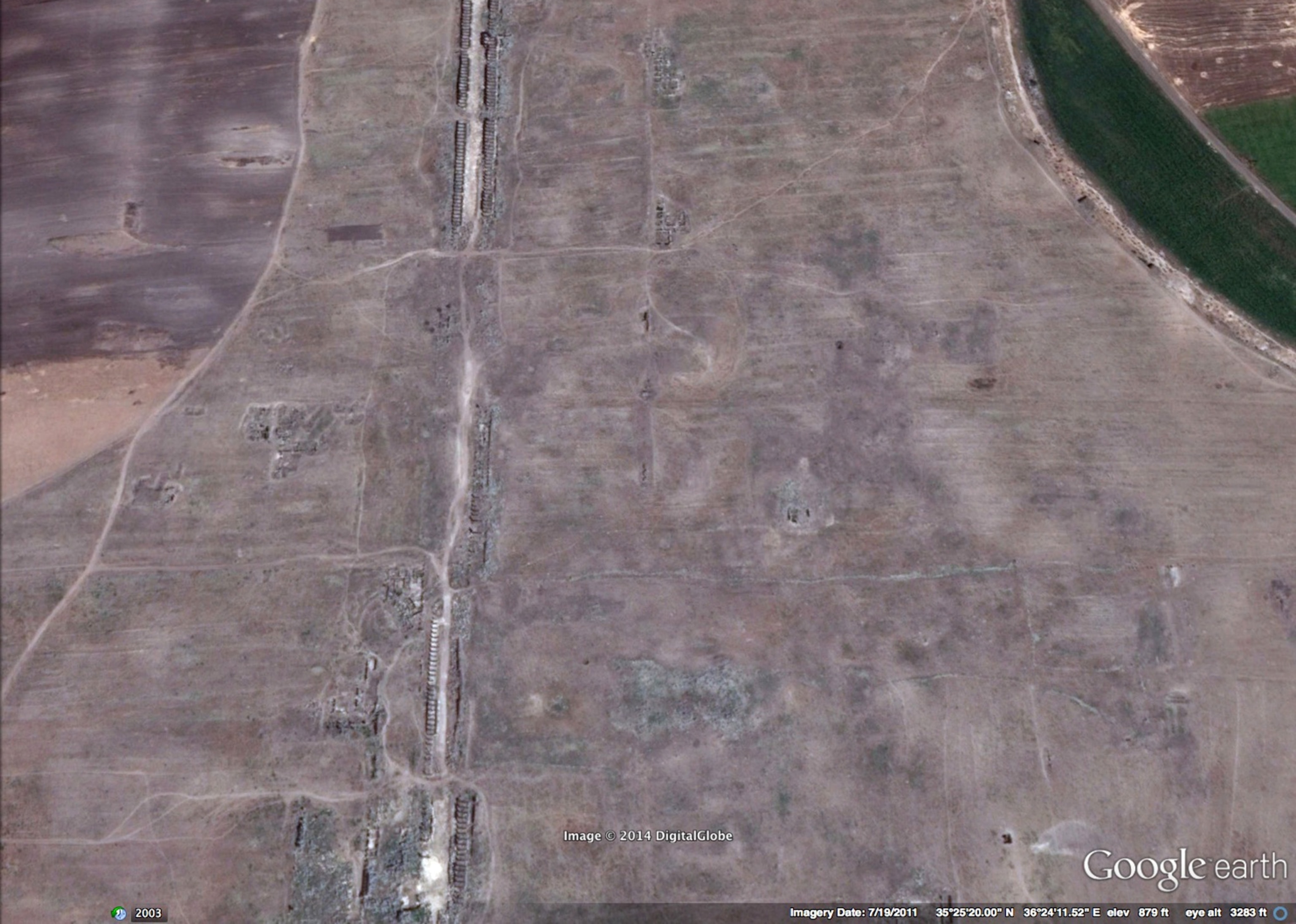 A picture taken on March 14, 2014 shows a Syrian policeman patrolling the ancient oasis city of Palmyra, 215 kilometres northeast of Damascus.
