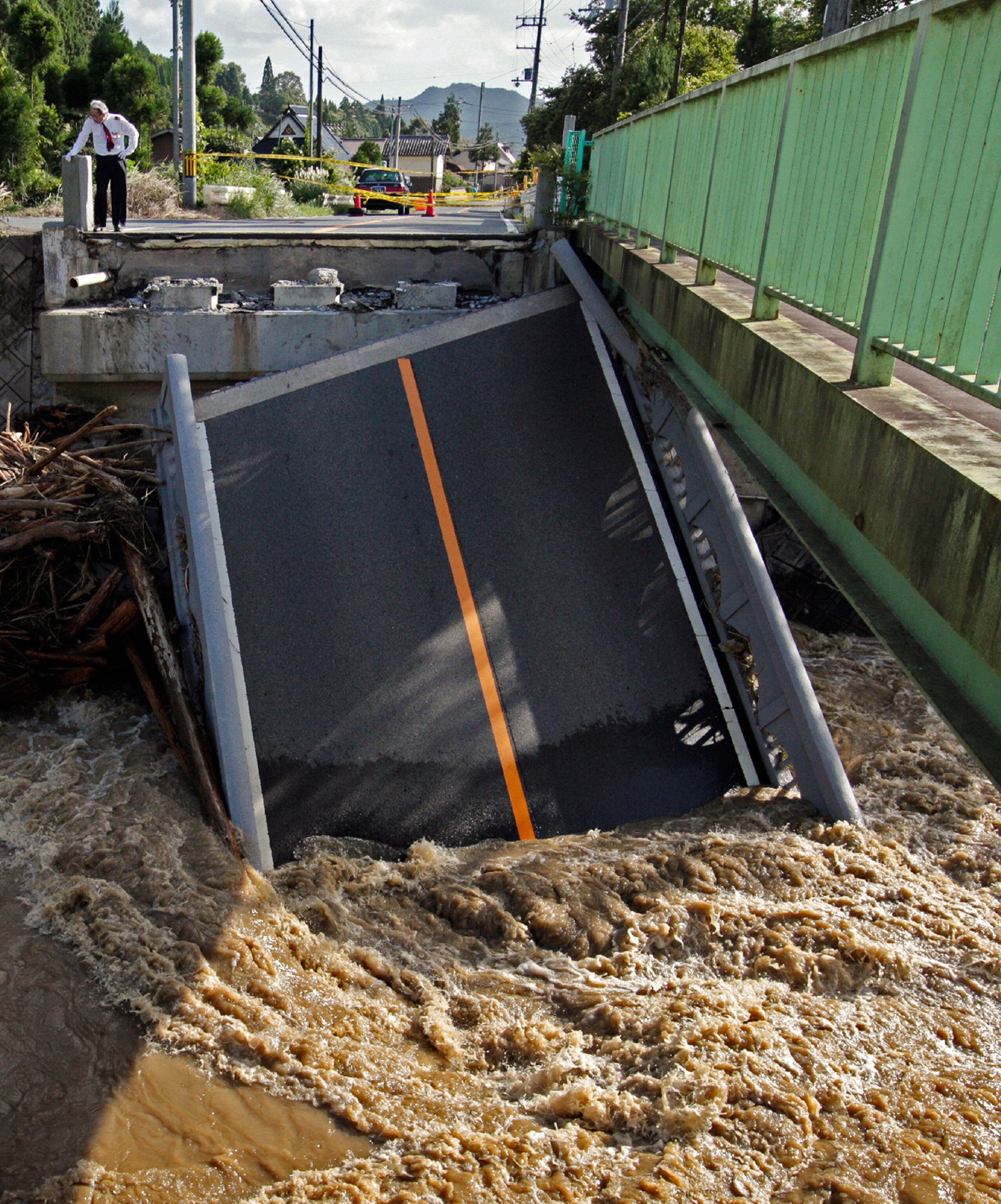 bridge collapse from Kyoto typhoon in Japan