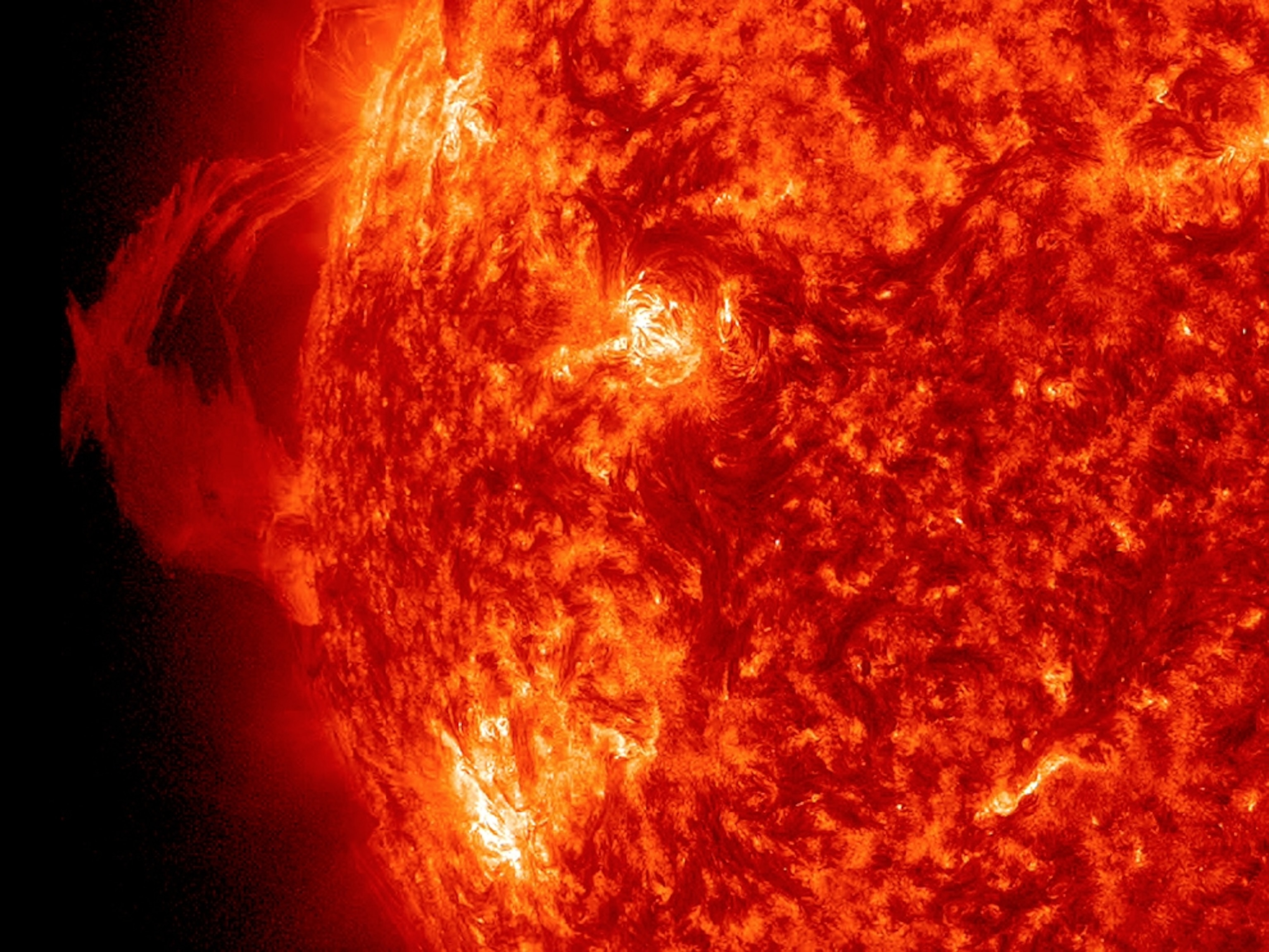 a plasma eruption swirled by magnetic field lines