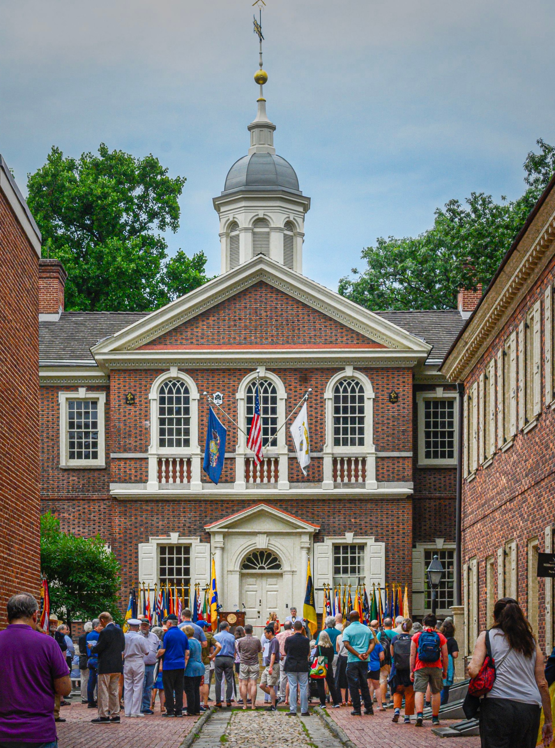 The First Continental Congress convened at Carpenters’ Hall in Philadelphia—a setting associated with common Americans—in September 1774 to debate how to respond to the Intolerable Acts that placed Massachusetts under military rule.
