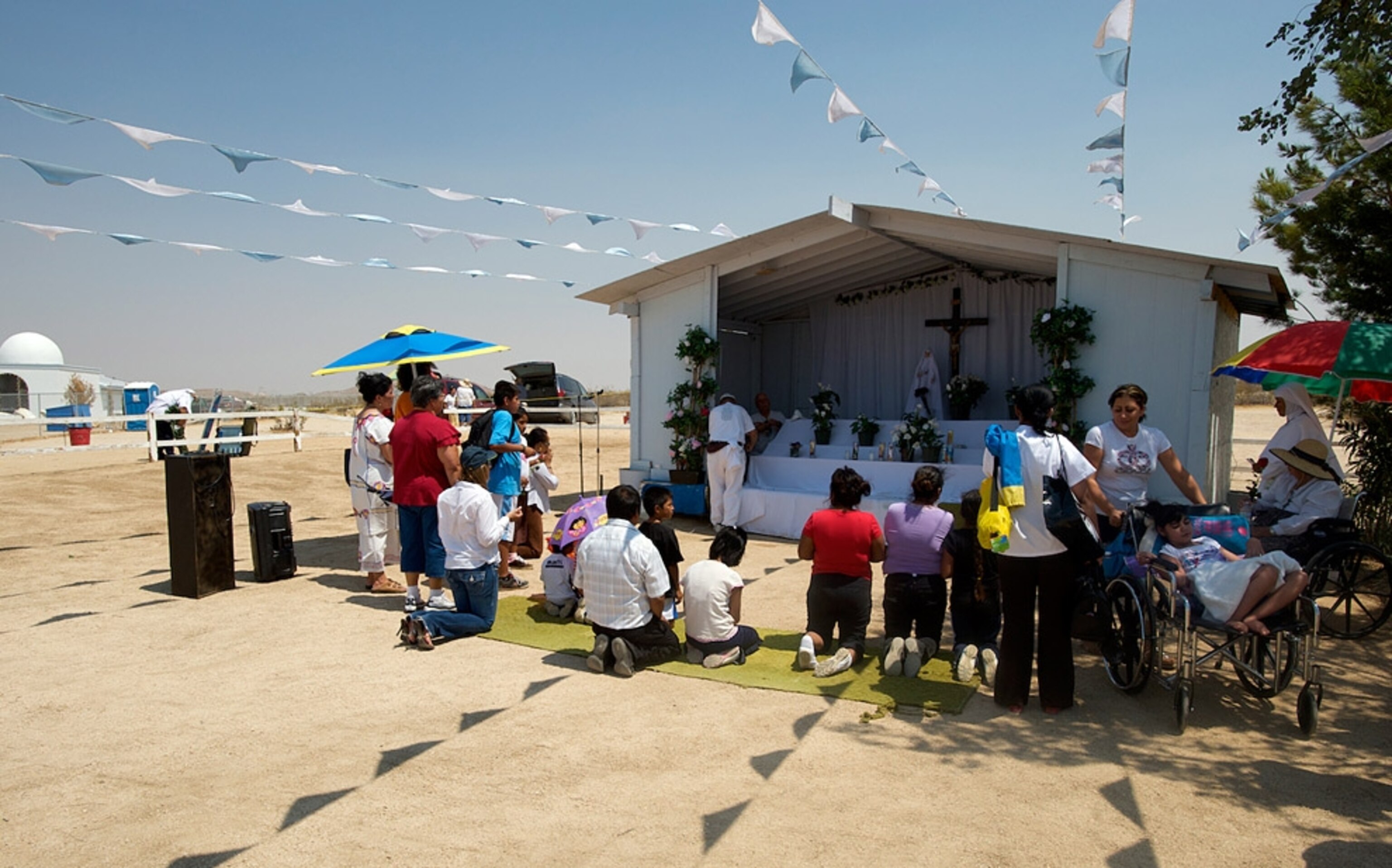 People praying before an altar