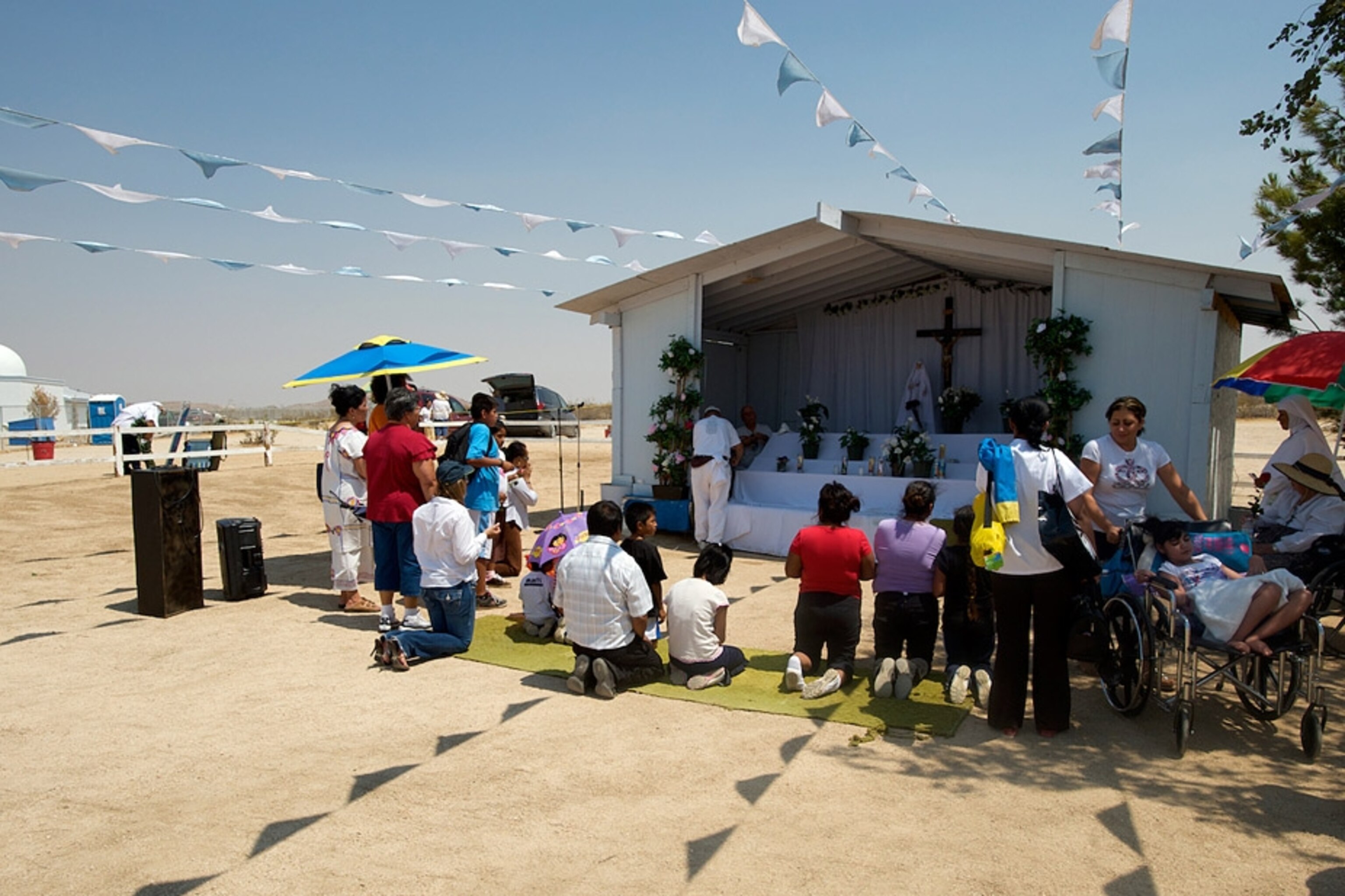 People praying before an altar