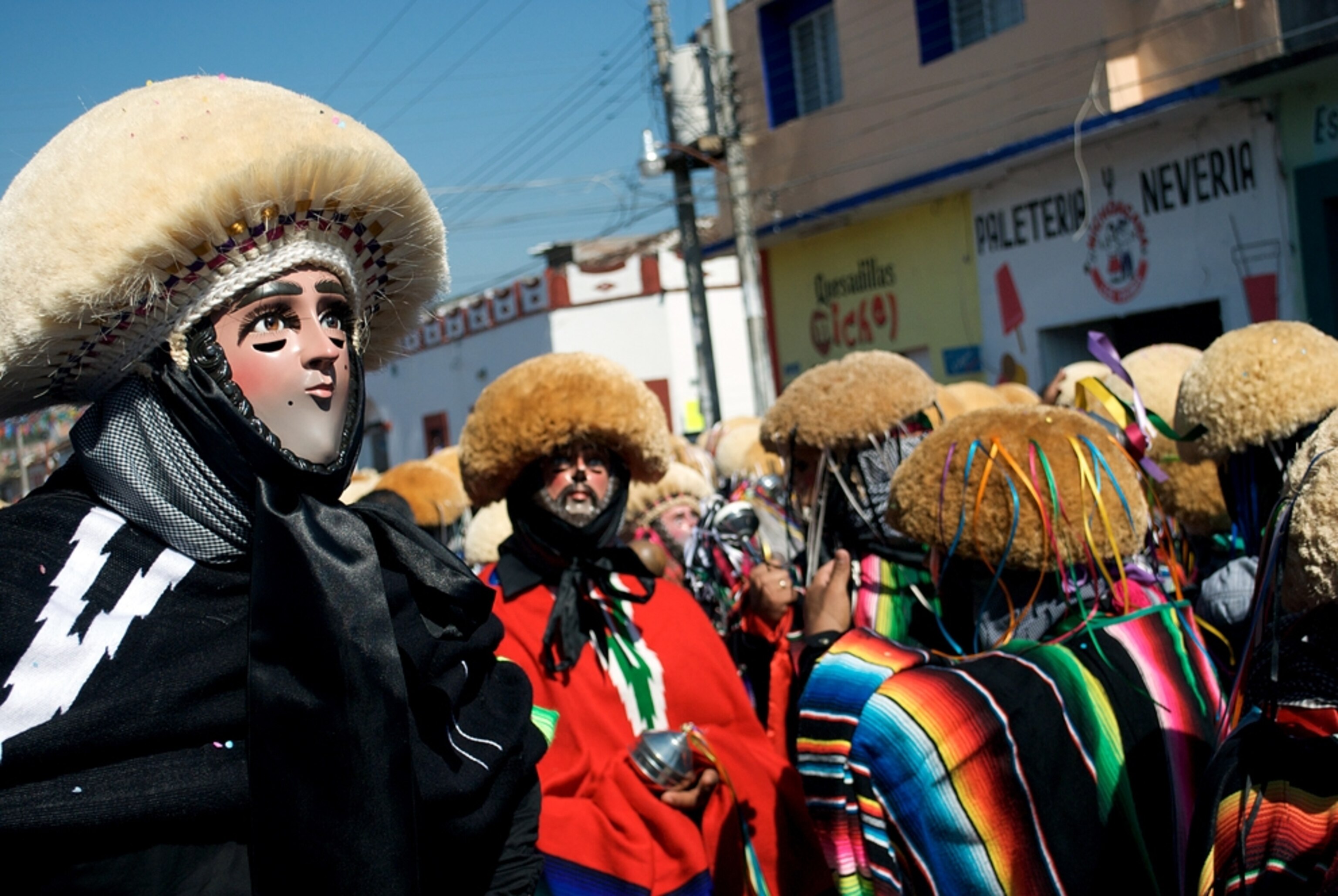 dancers and masked men at the Chiapa de Corzo festival, Chiapas, Mexico