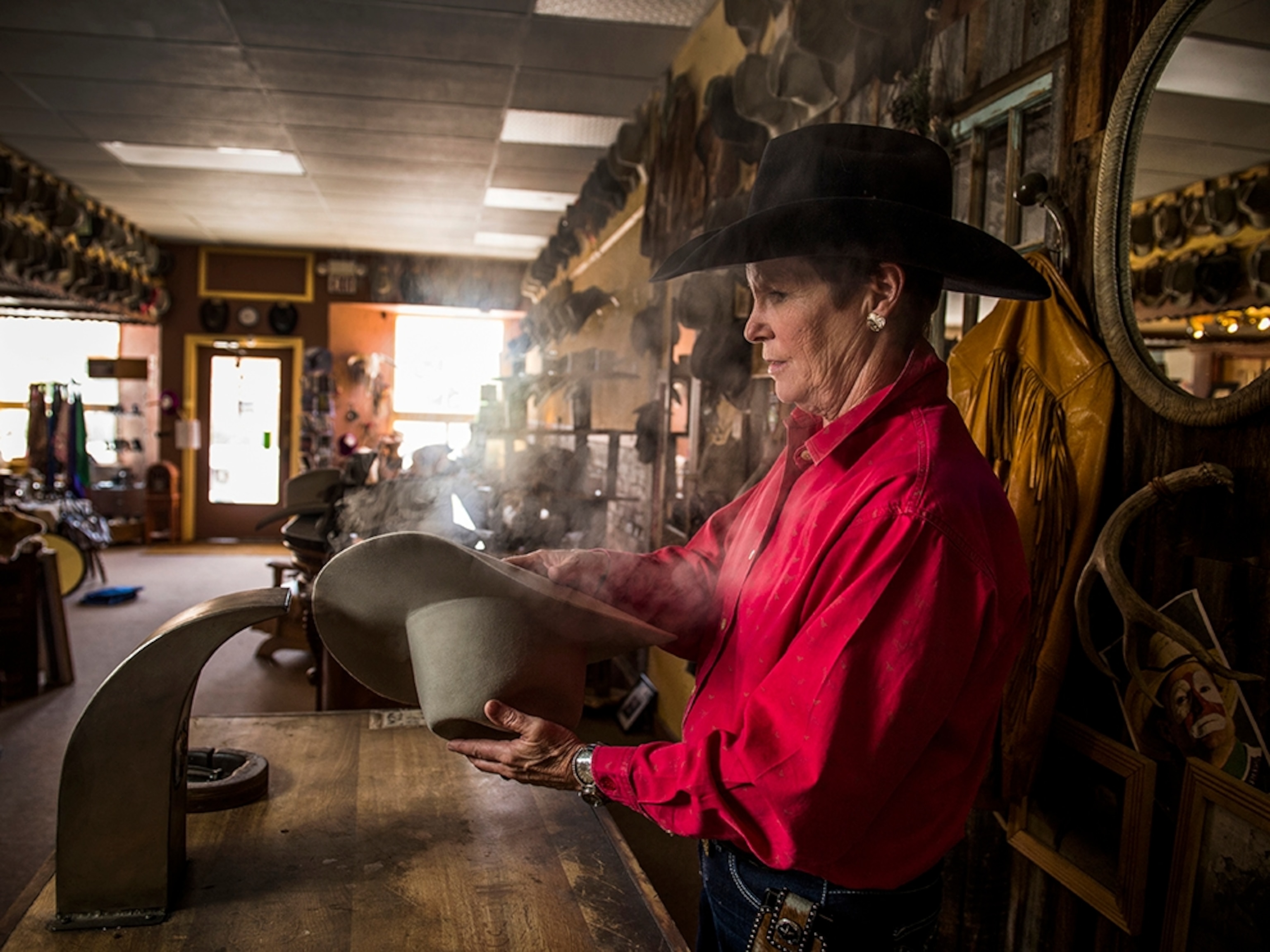 hatmaker Sheila Kirpatrick showing off her famous creations in Twin Bridges, Montana