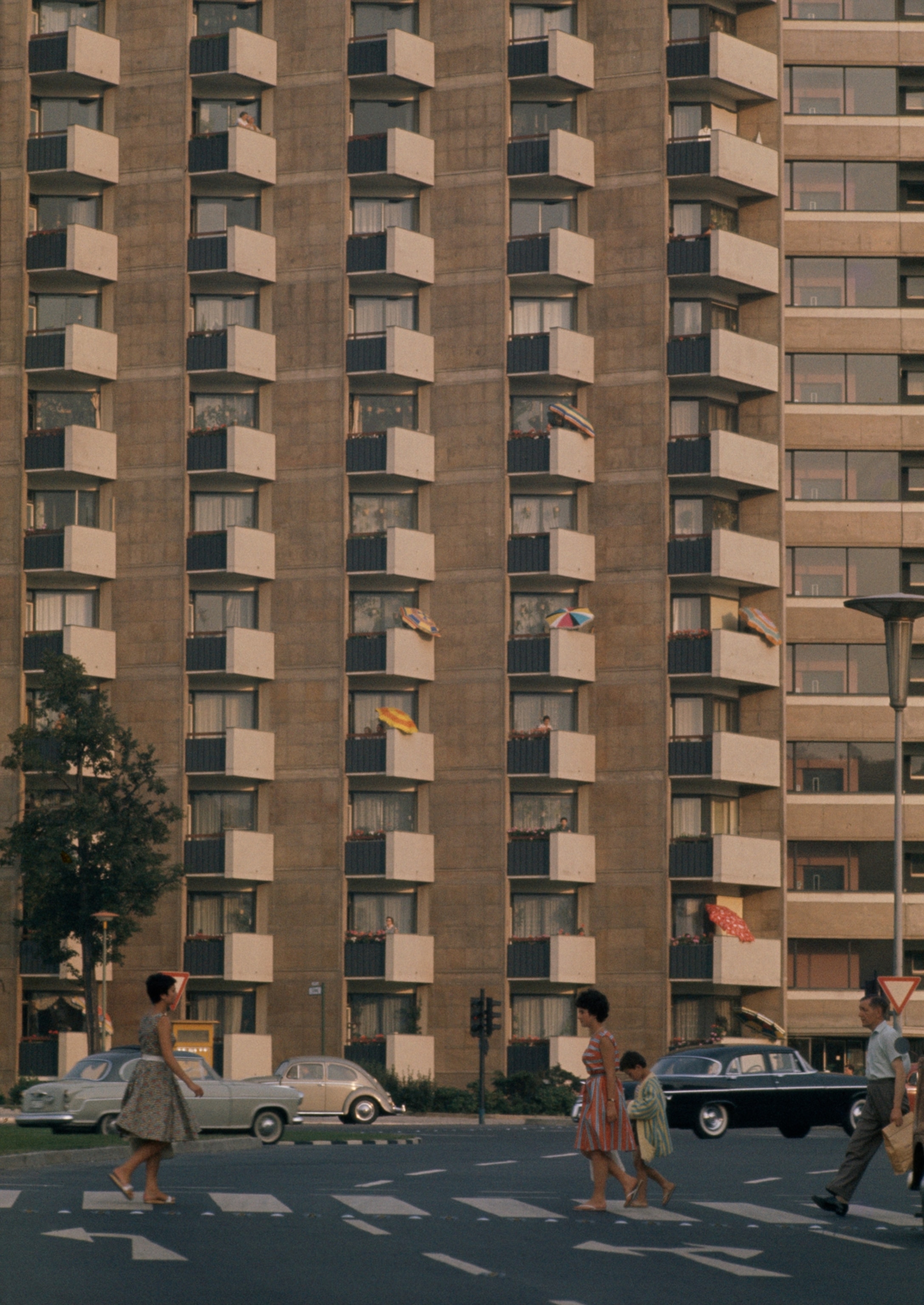 Balconied apartment building faces busy Rahtenau Platz. More than 200,000 houses and apartments have risen since 1949; every fourth West Berliner in a new flat.