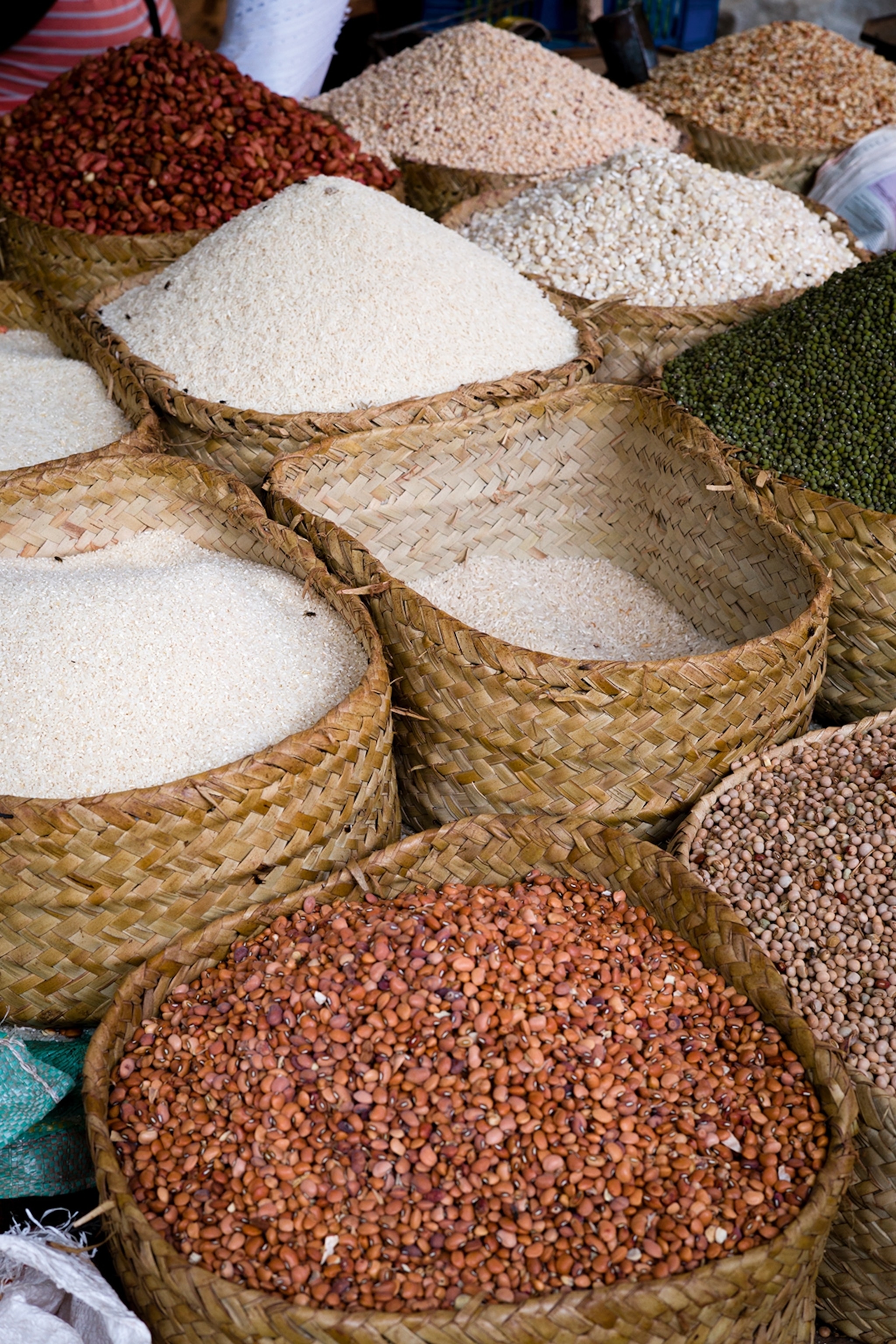 A close-up of big baskets filled with different spices.