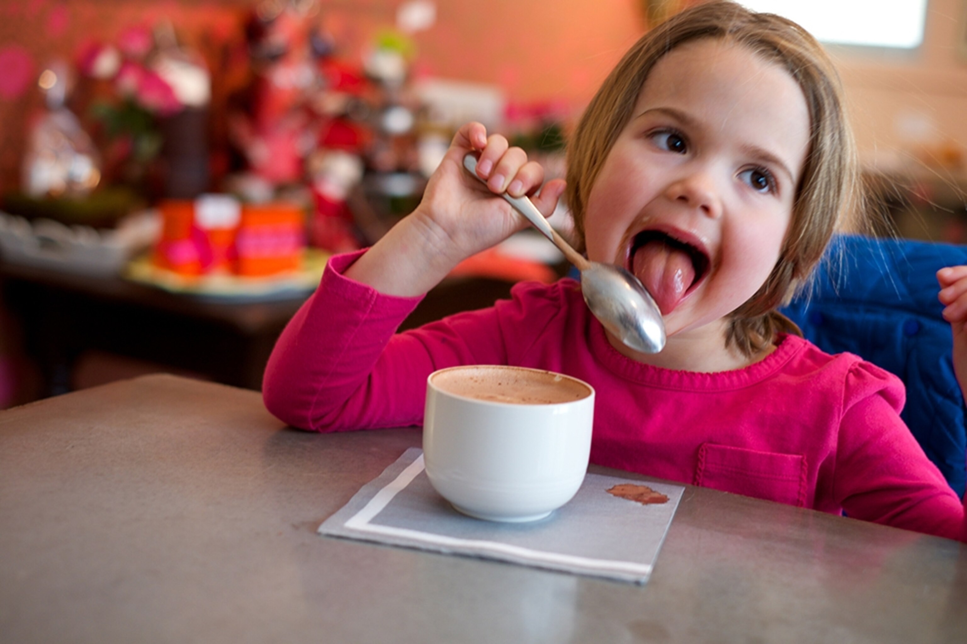 a young girl enjoying hot chocolate in Bozeman, Montana