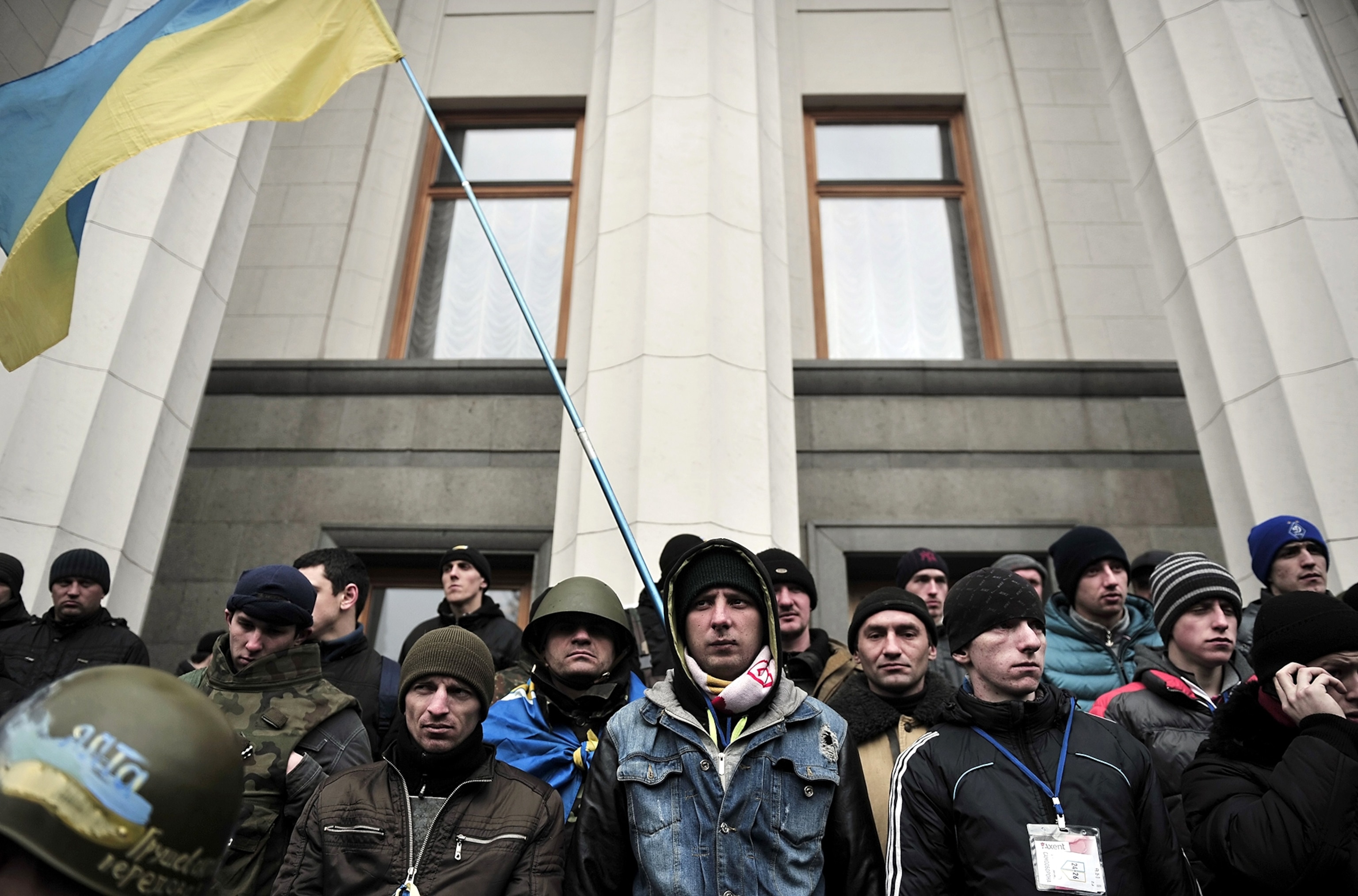 Unidentified armed men patrol outside of Simferopol airport, on February 28, 2014.