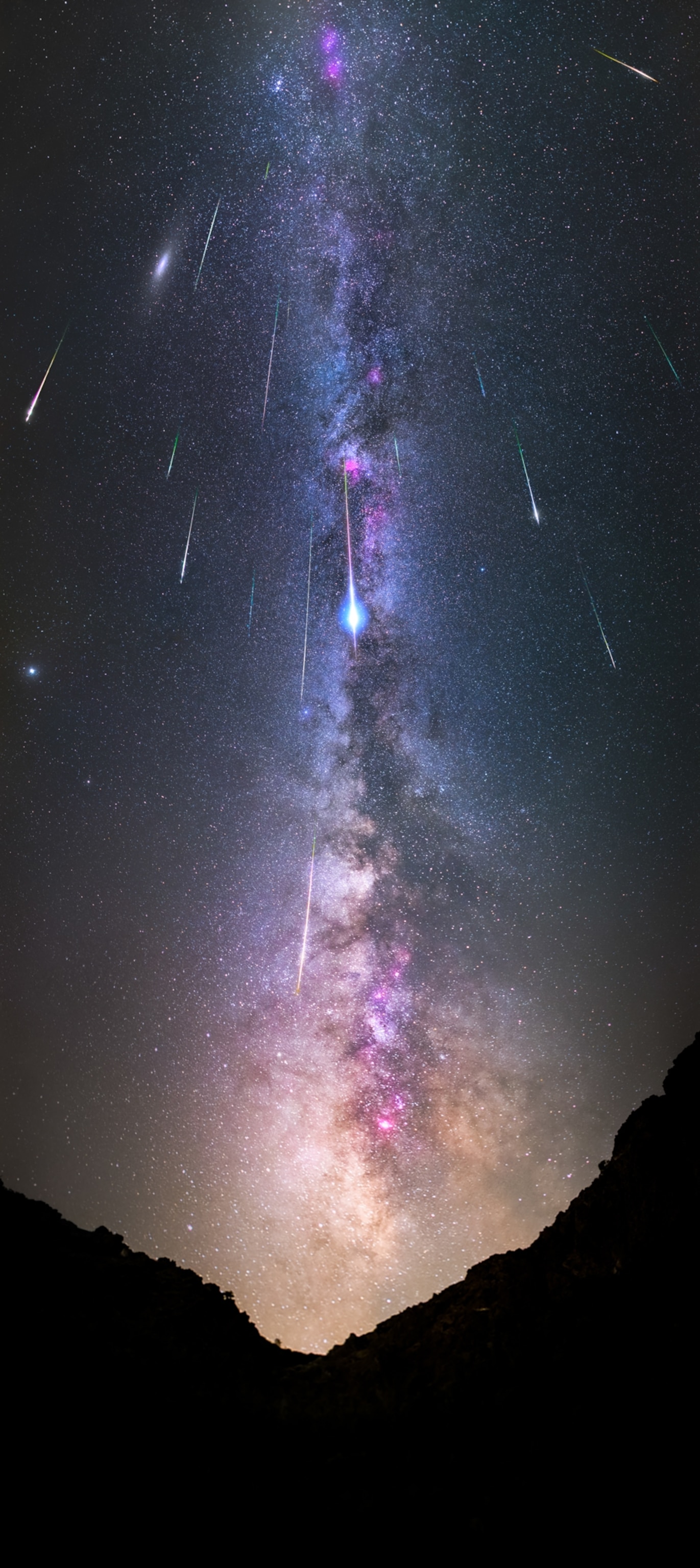 Brights streaks from meteors passing in front of the Milky Way