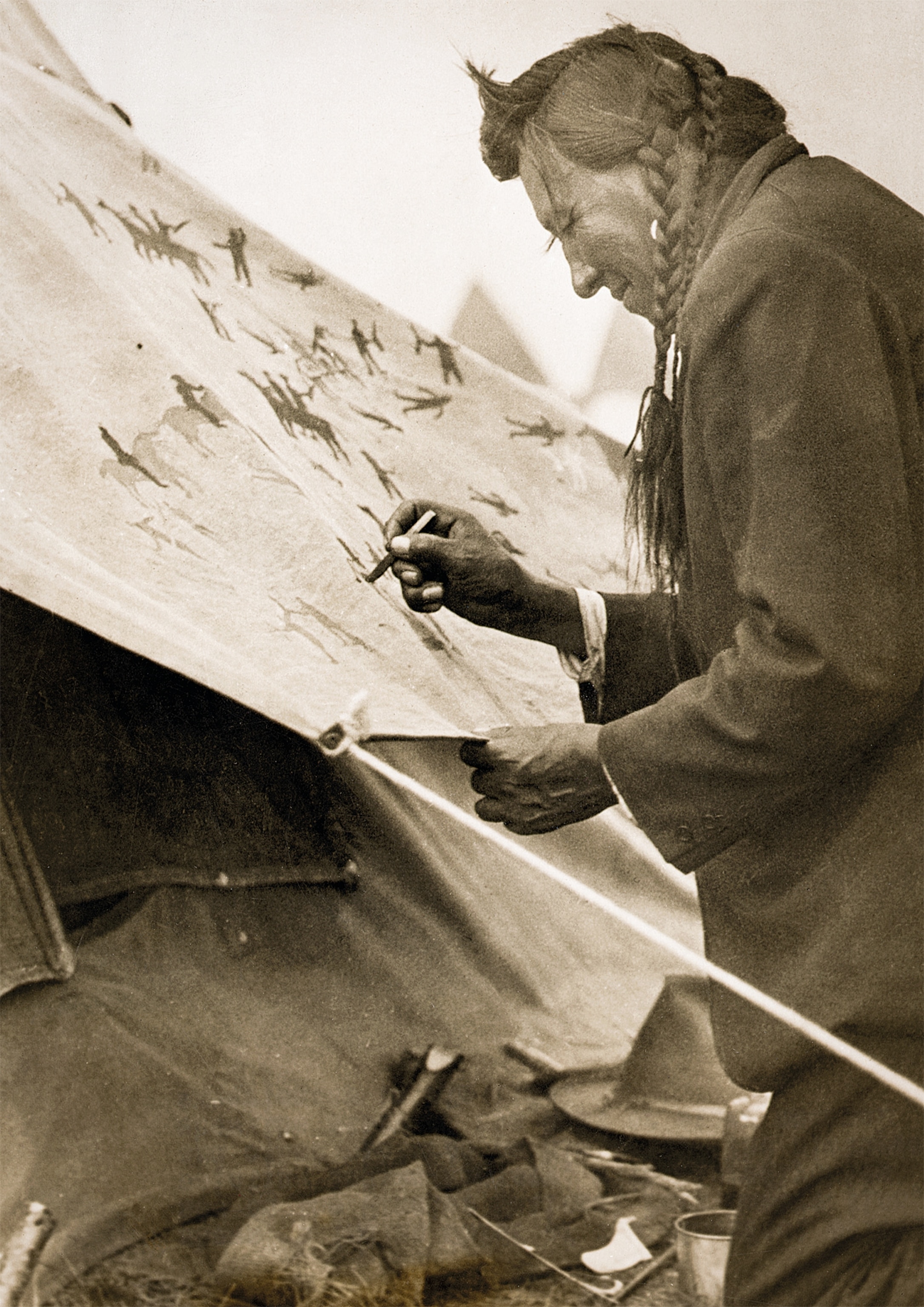 Blackfoot chief inscribes his tepee.