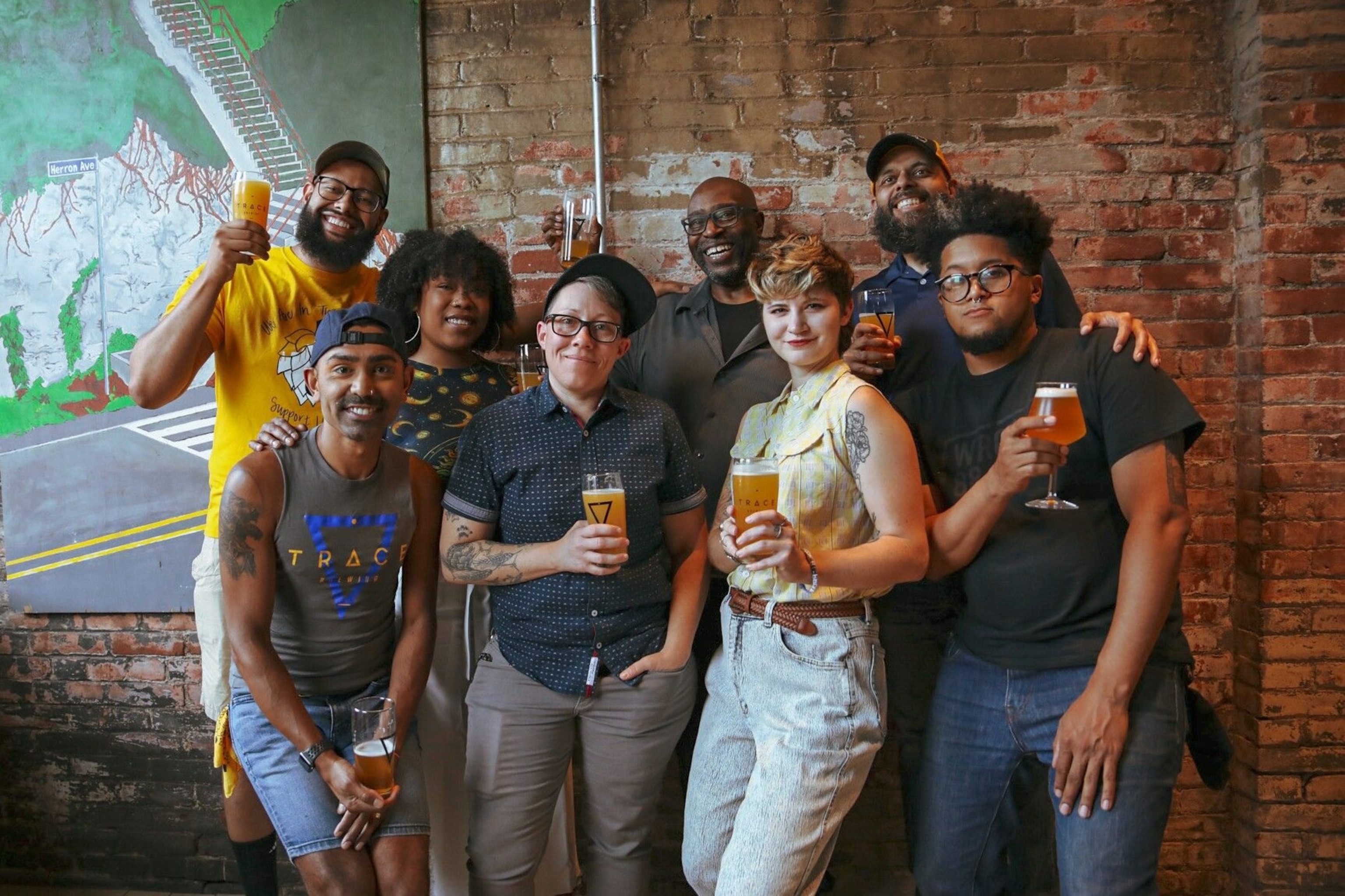 Members of the Pittsburgh Brewery Diversity Council (PBDC), with Aadam Soorma on the left of the front row, at Trace Brewing. The PBDC debuted its collaborative beer series — She Knows Beer — at Trace alongside partners at Necromancer Brewing. Portions of sales proceeds from all breweries who produce She Knows Beer are donated to local nonprofits working to elevate women and minorities.