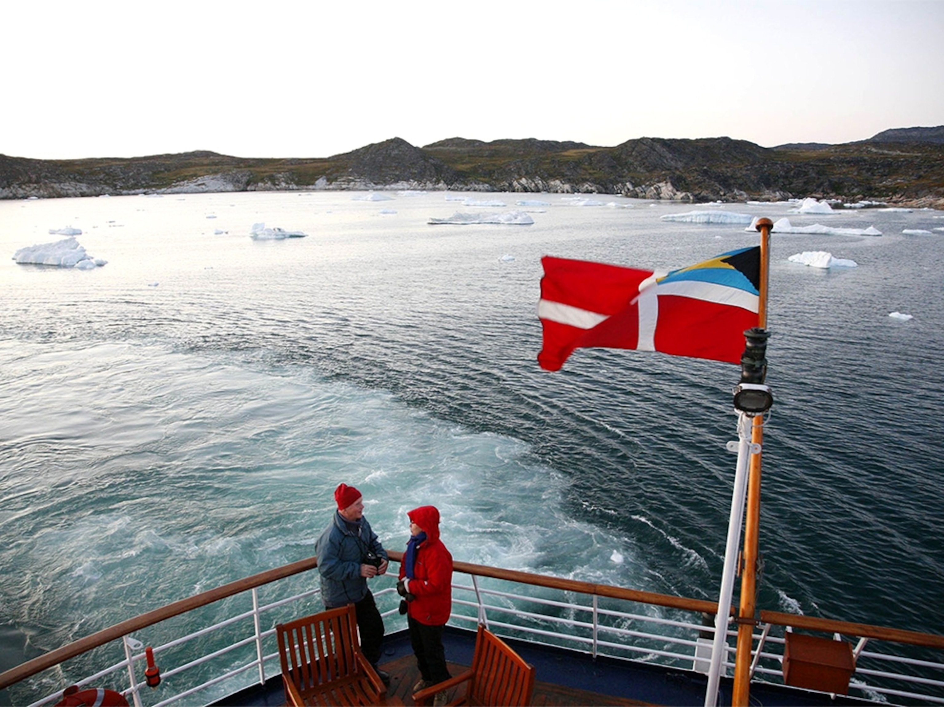 a ship cruising through Disko Bay, Greenland