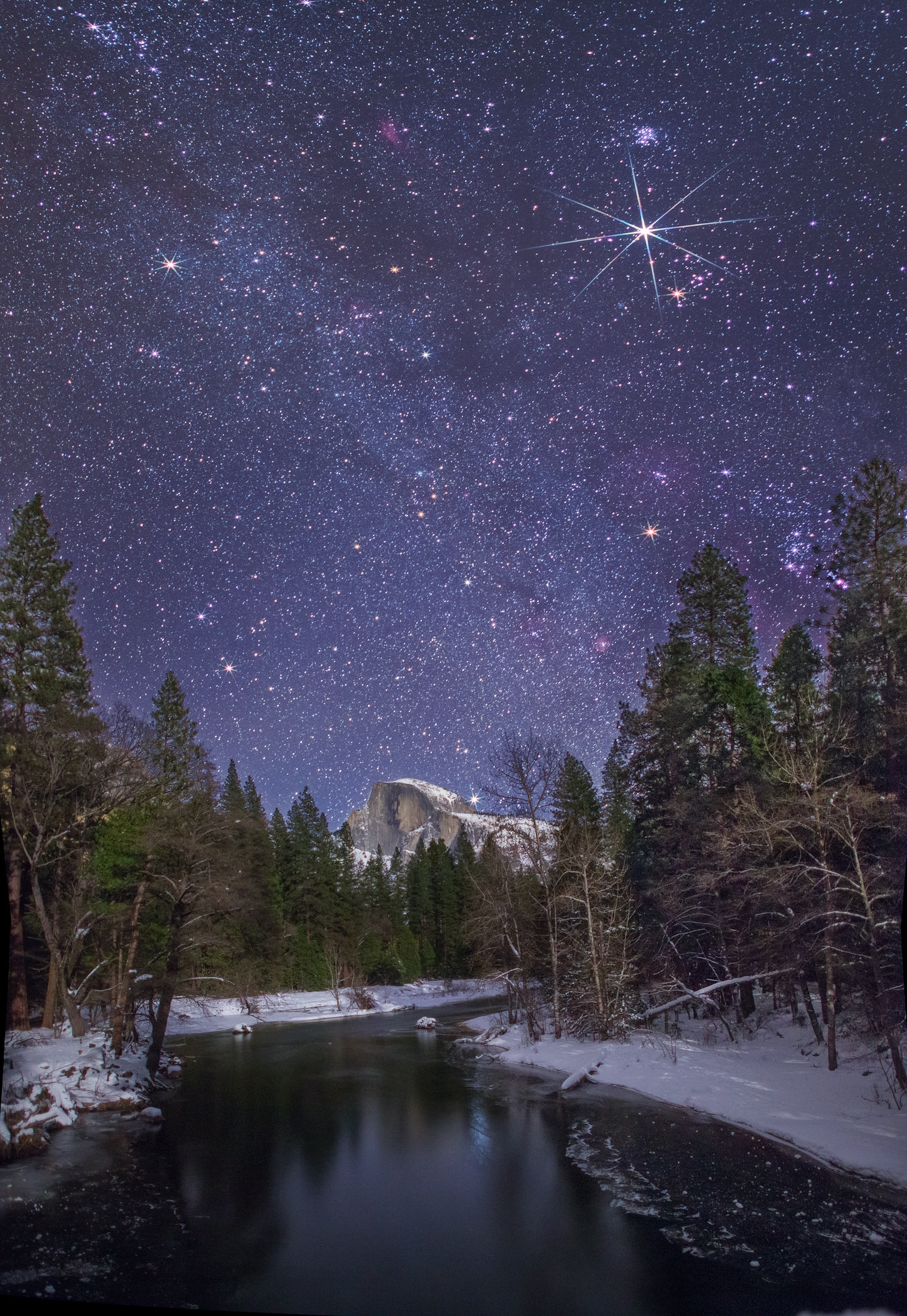 the stars in the night sky above Half Dome in Yosemite