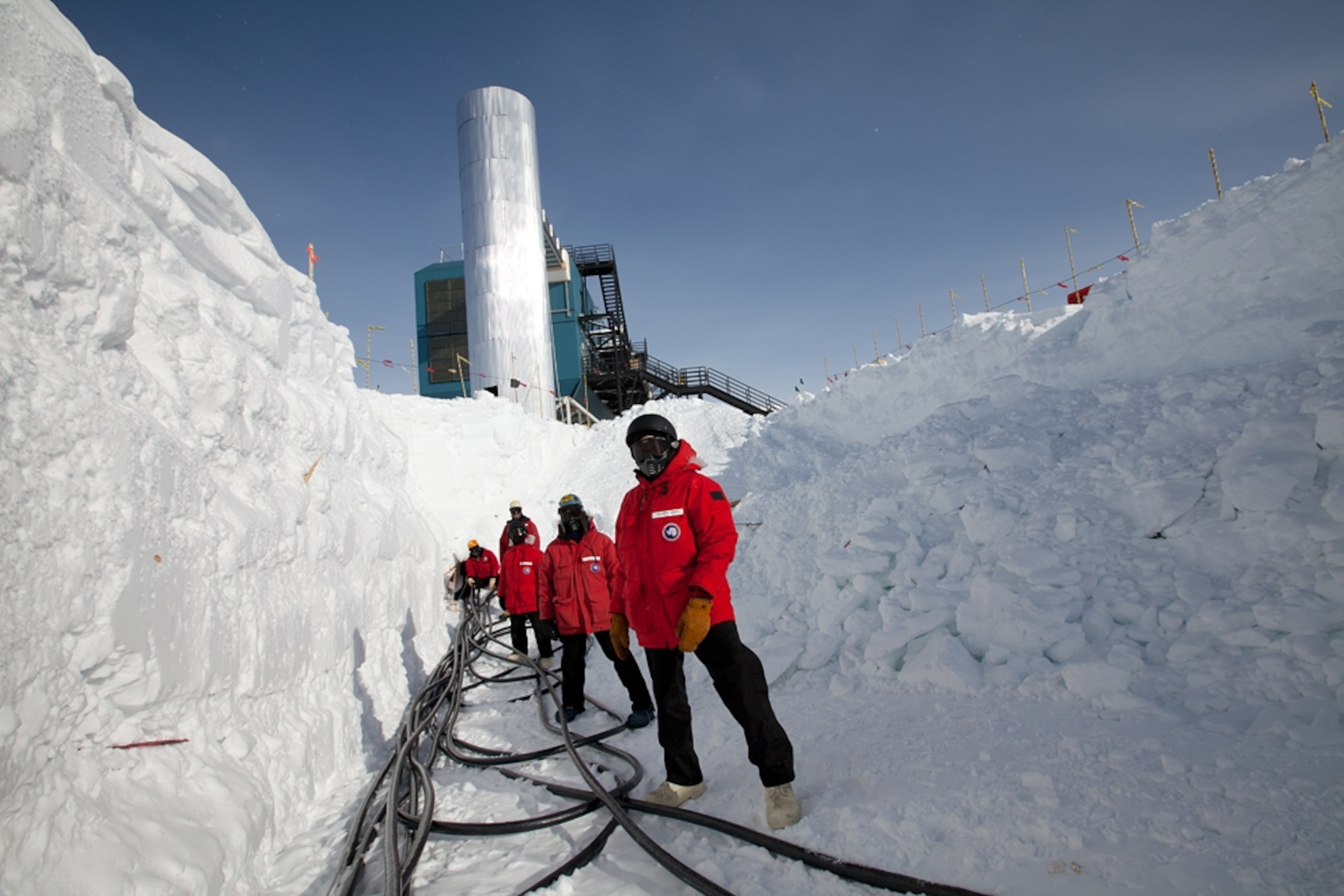 IceCube scientists participating in a cable pull -- picture from a photo gallery on the IceCube Neutrino Observatory at the South Pole in Antarctica