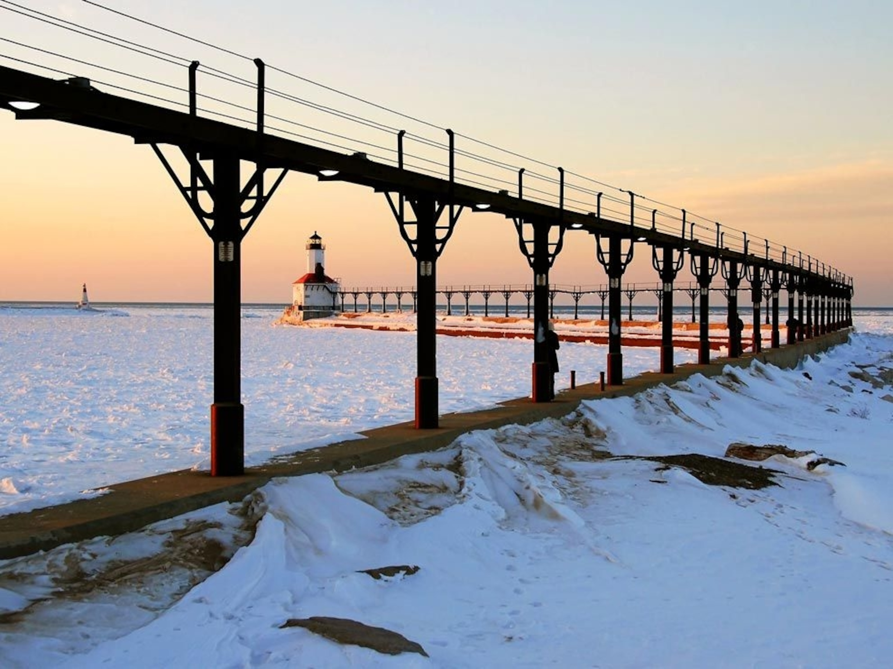 a walkway leading to a lighthouse