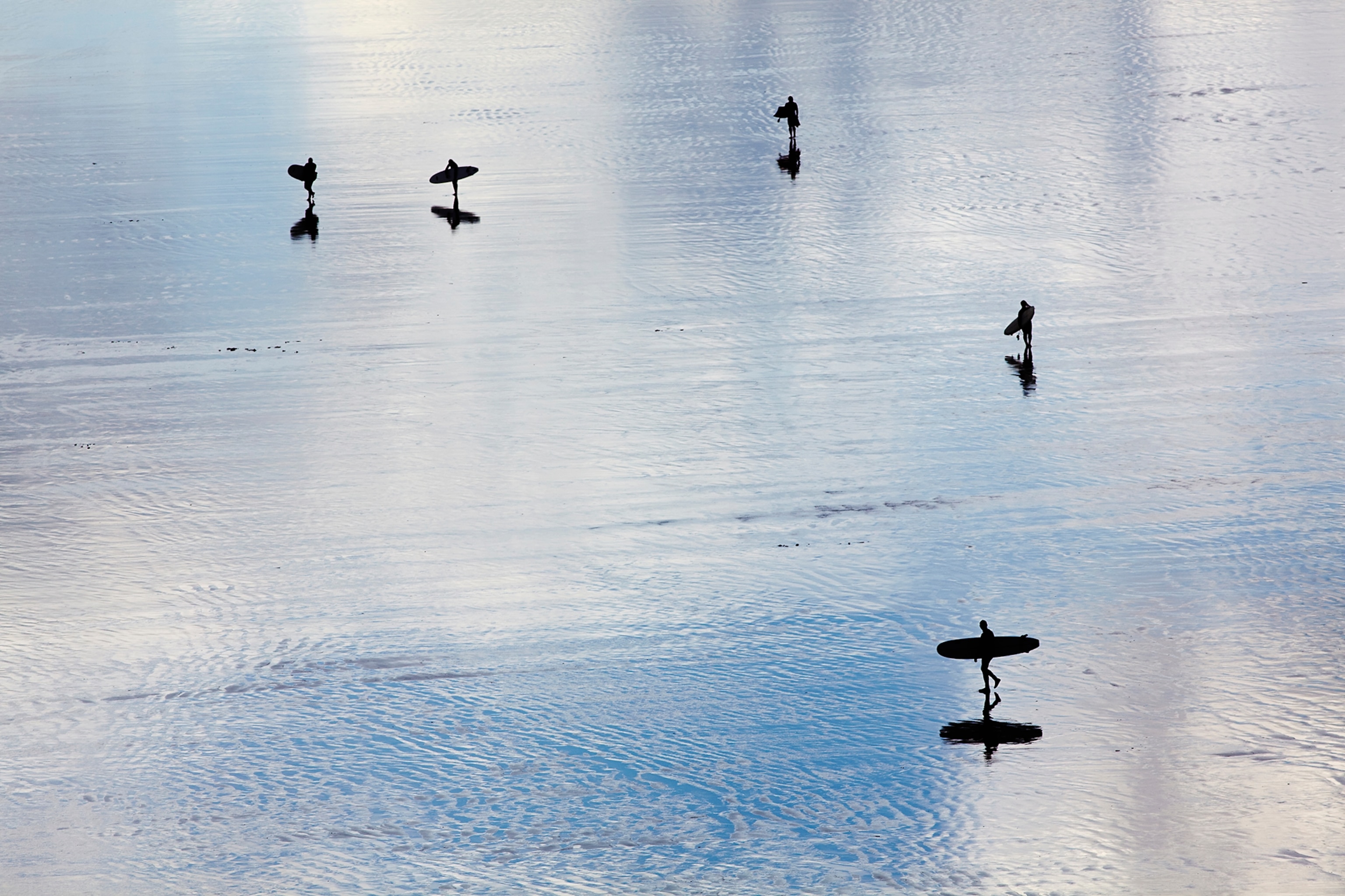 surfers in silhouette