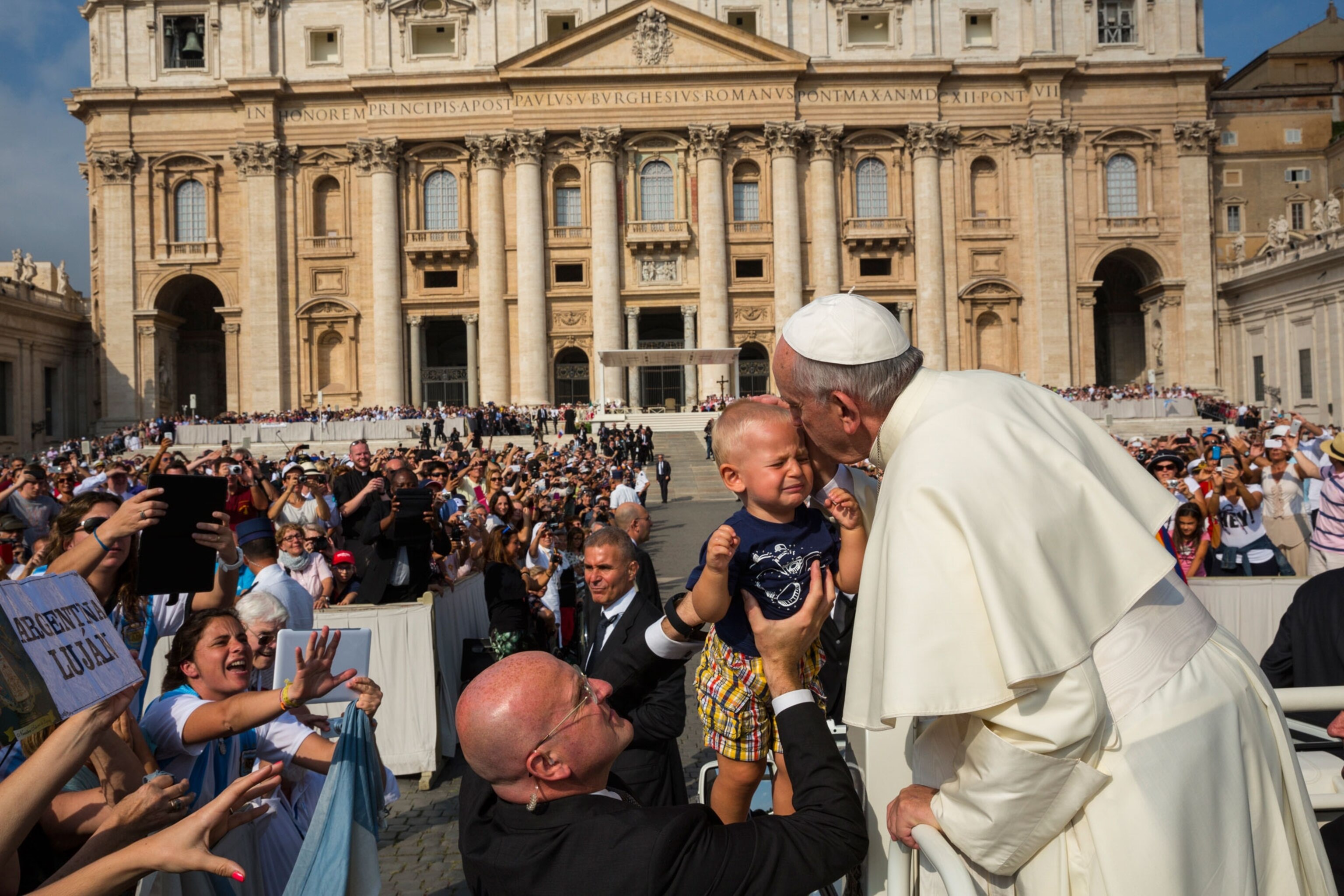 Pope Francis kissing a baby