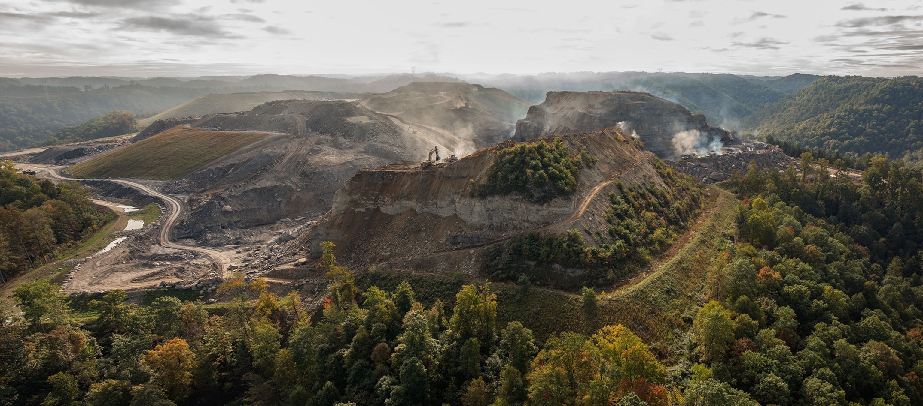 Spruce Mine is operated by Mingo Logan Coal company owned by Arch Coal an International Coal Company based in St. Lous, MO. This site is located in Logan County WV and is a massive site that shows the full consequences of MTR mining. The smoking fissures and dust emitted by the blasting and coal extraction is apocalyptic type setting.